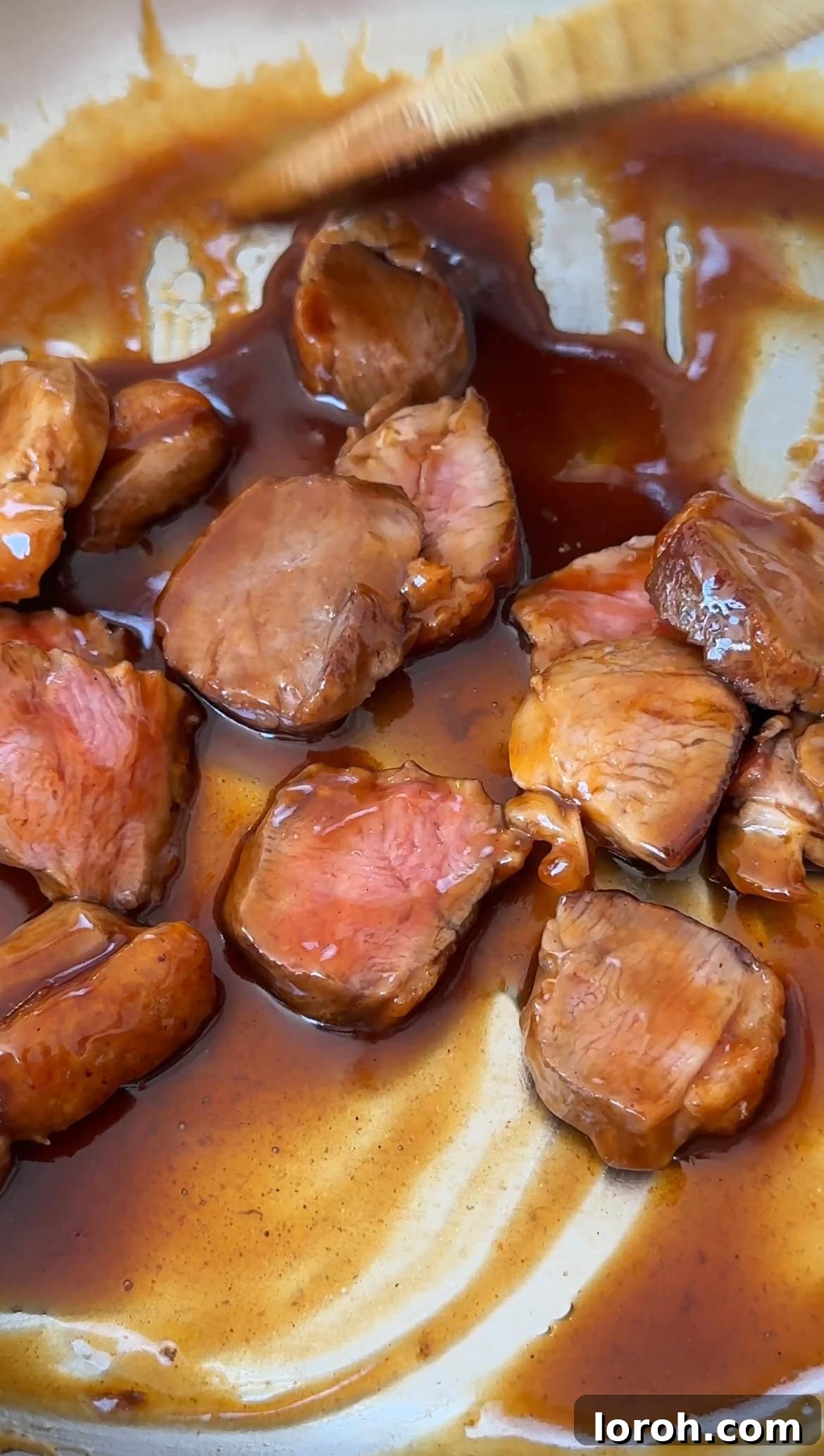 Peking Duck Bao Pockets 6 Step three: Sliced duck breast being coated in hoisin-honey sauce.