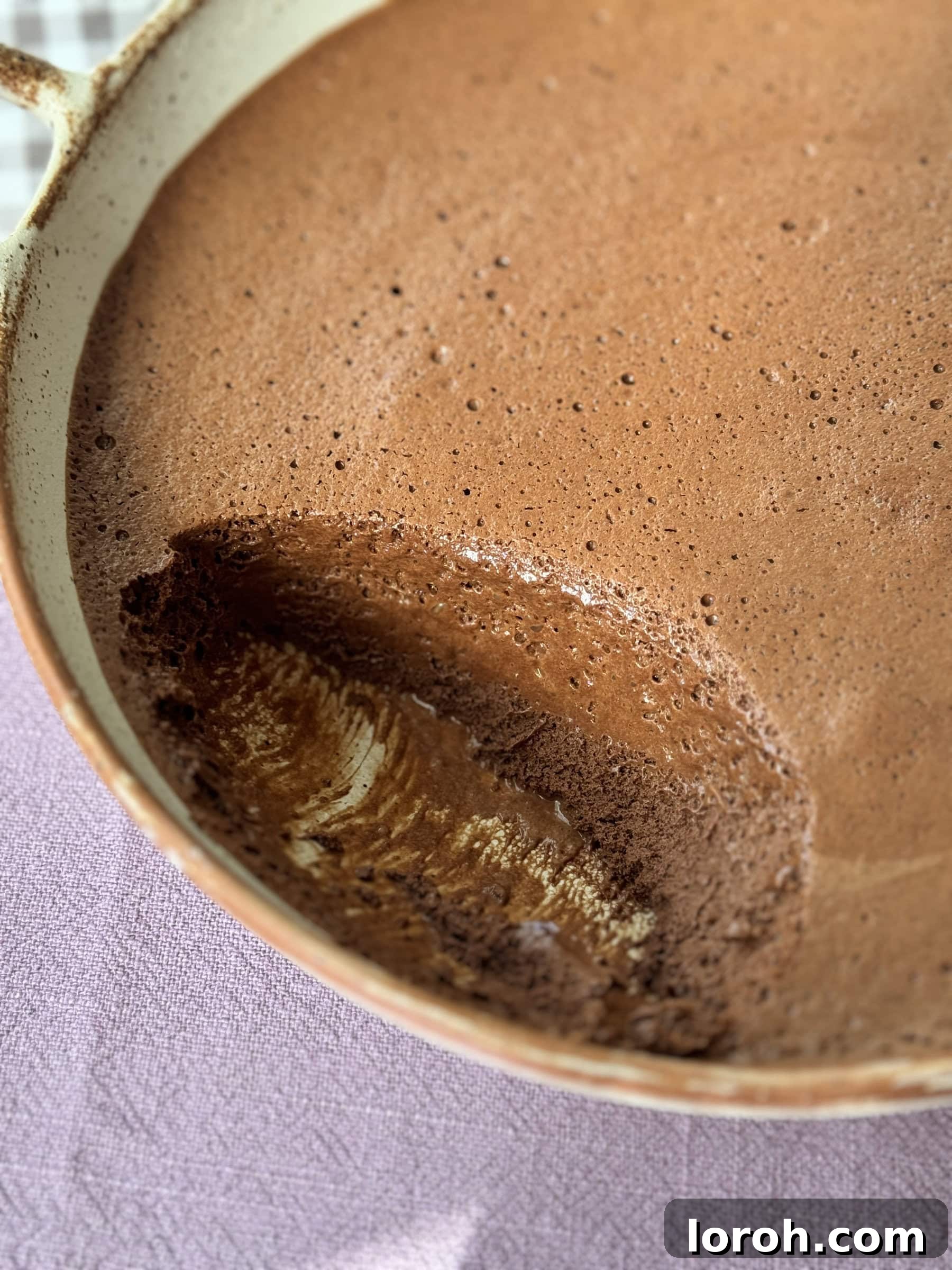 Decadent French chocolate mousse served in a glass bowl, showcasing its smooth and airy texture.