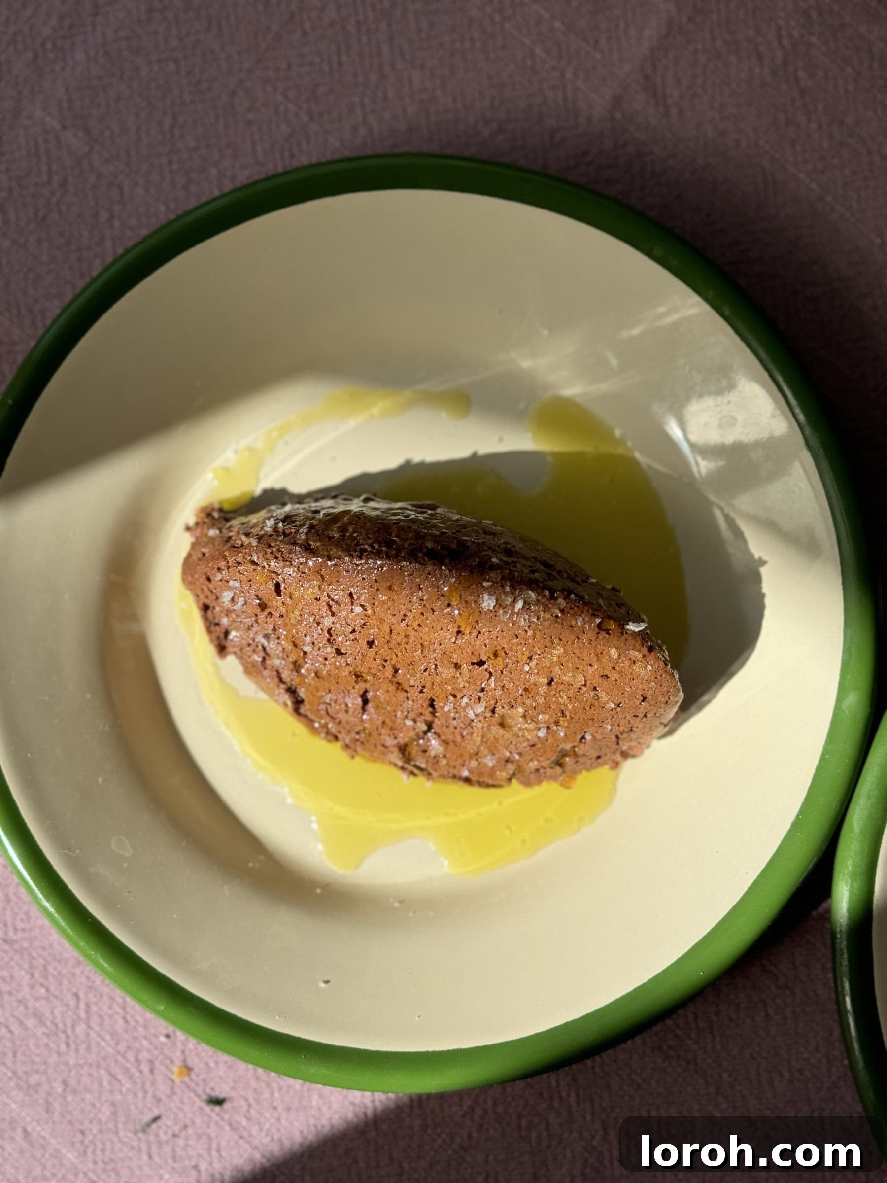 Mousse Au Chocolat garnished with a drizzle of olive oil and sea salt flakes.