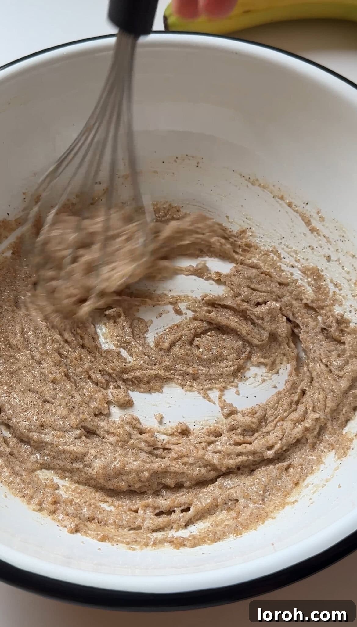 Folding the brown butter into sugar mixture.