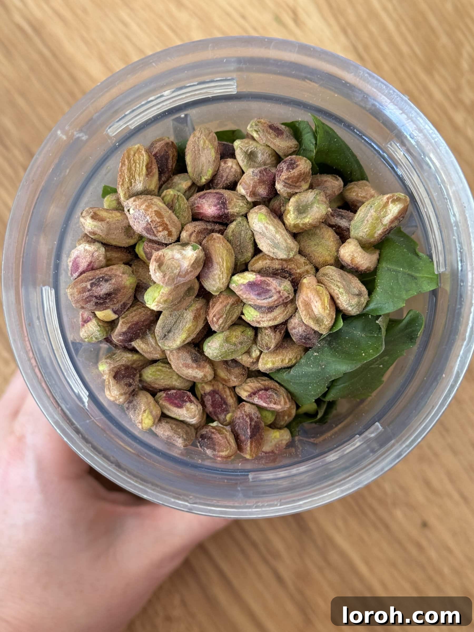 Emerald Pistachio Pesto 5 basil, garlic, lemon, pepper, and olive oil in a blender for pistachio pesto