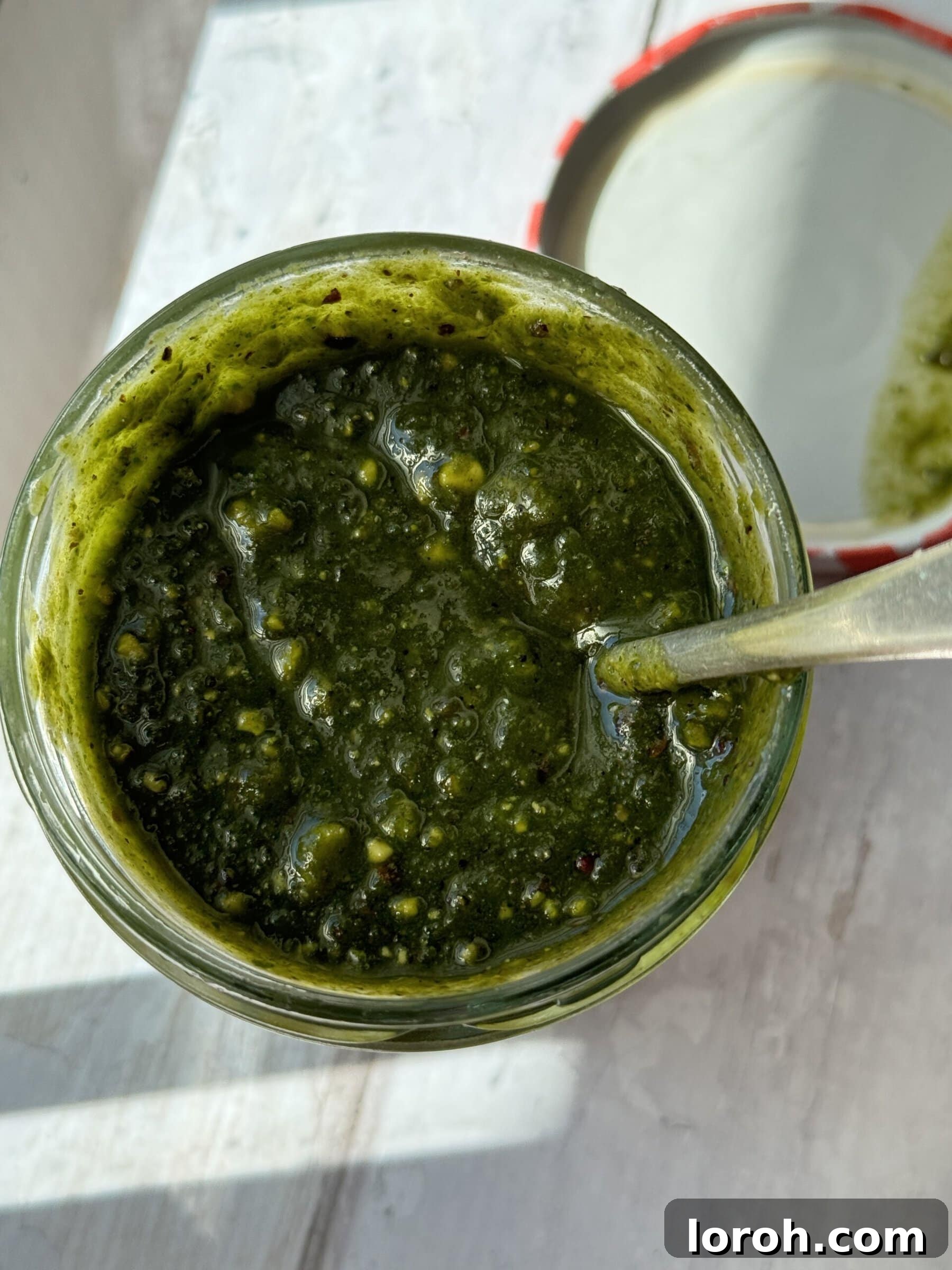 Emerald Pistachio Pesto 9 close-up of pistachio pesto in a bowl, showing texture