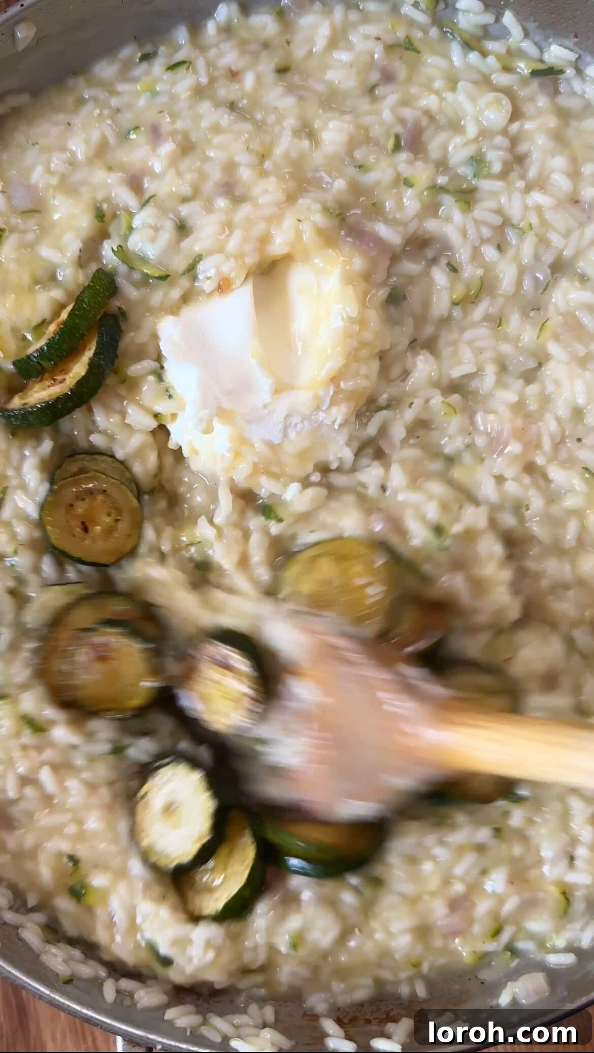 Creamy Zucchini Risotto 9 stirring in mascarpone, parmesan, and fried courgette into risotto