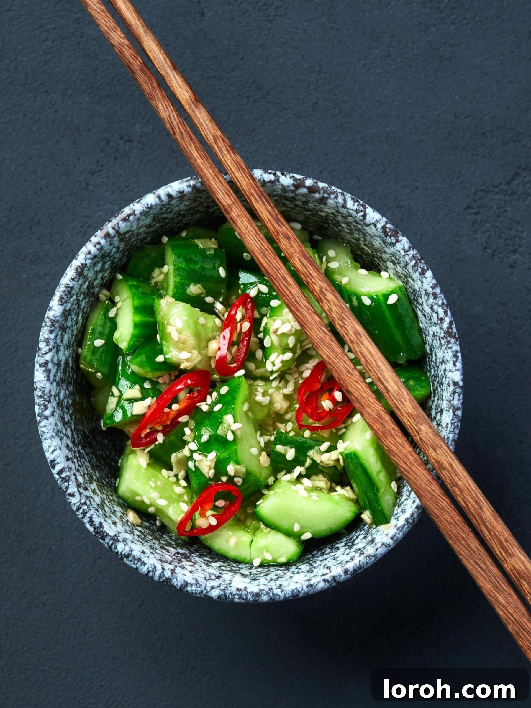 Sticky Soy Garlic Chicken 5 Step one: slicing cucumber for salad preparation