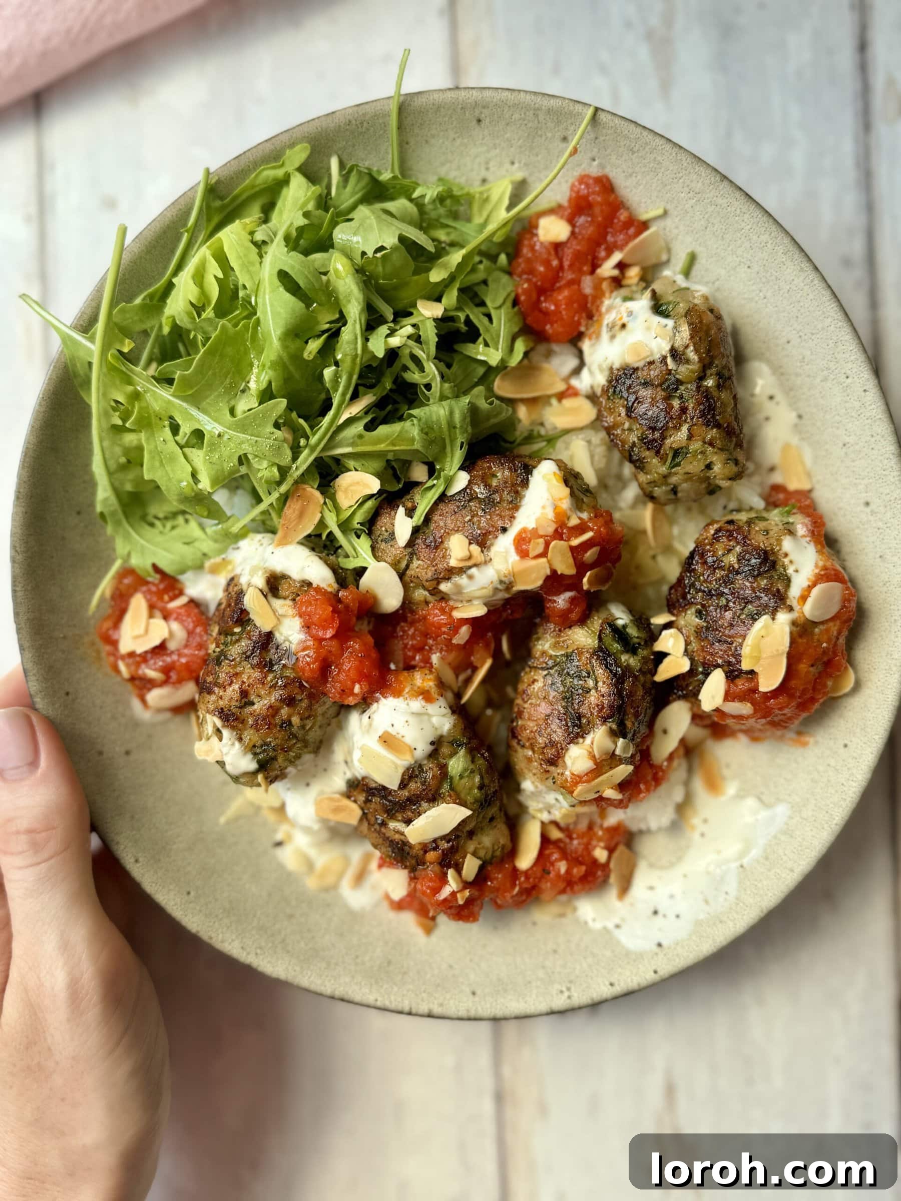 Spicy Tomato Chicken Kofta Bowls 3 Close-up of delicious chicken koftas cooking in a pan, golden brown and perfectly seared.