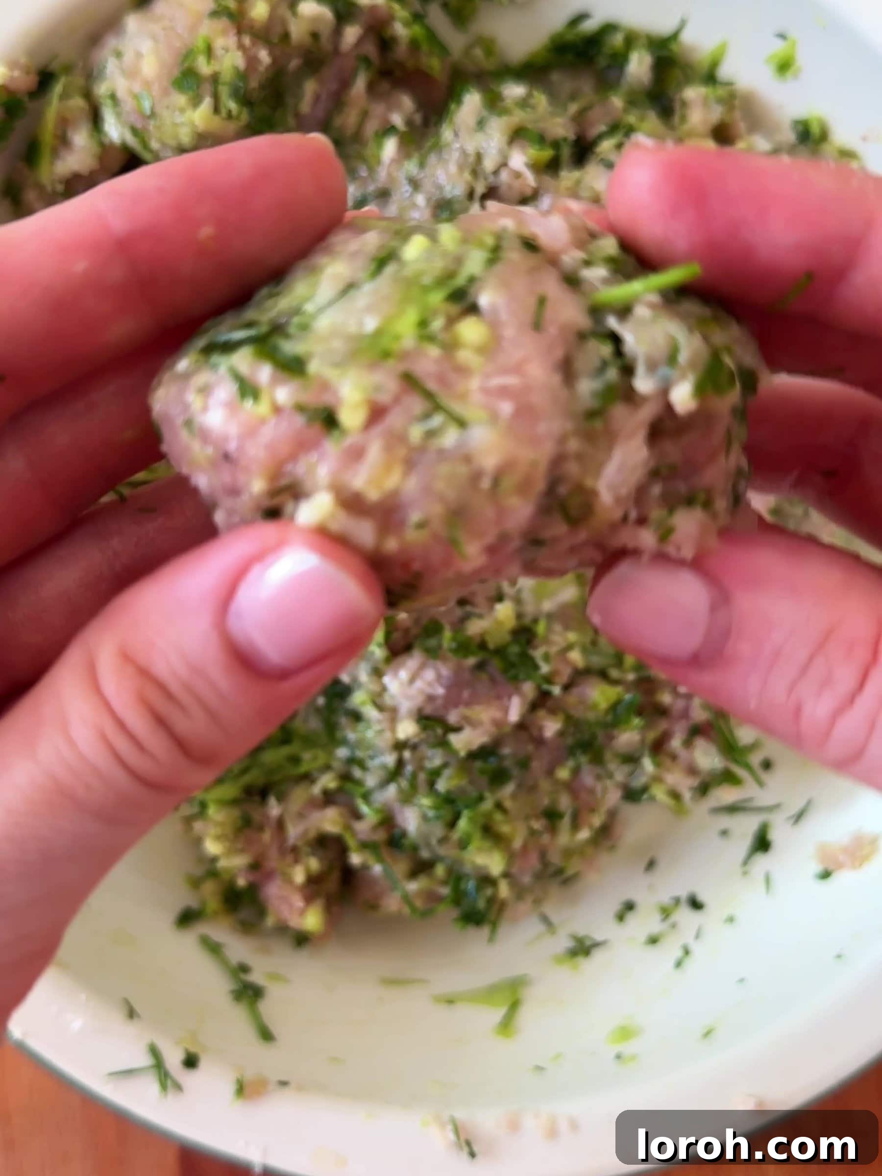 Spicy Tomato Chicken Kofta Bowls 6 Shaping the chicken kofta mixture into oblong shapes with wet hands.