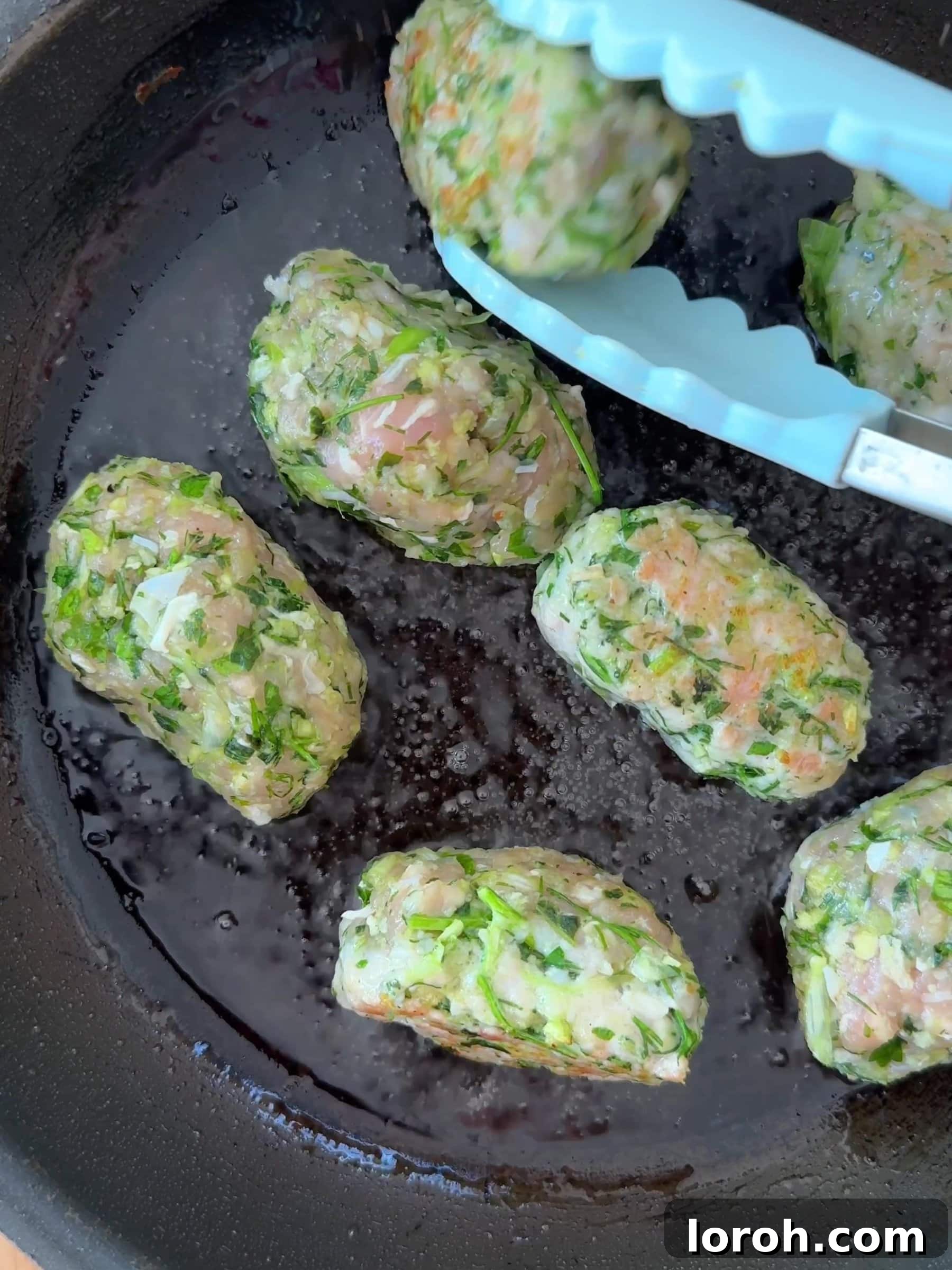 Spicy Tomato Chicken Kofta Bowls 8 Frying chicken koftas in a pan until golden brown.
