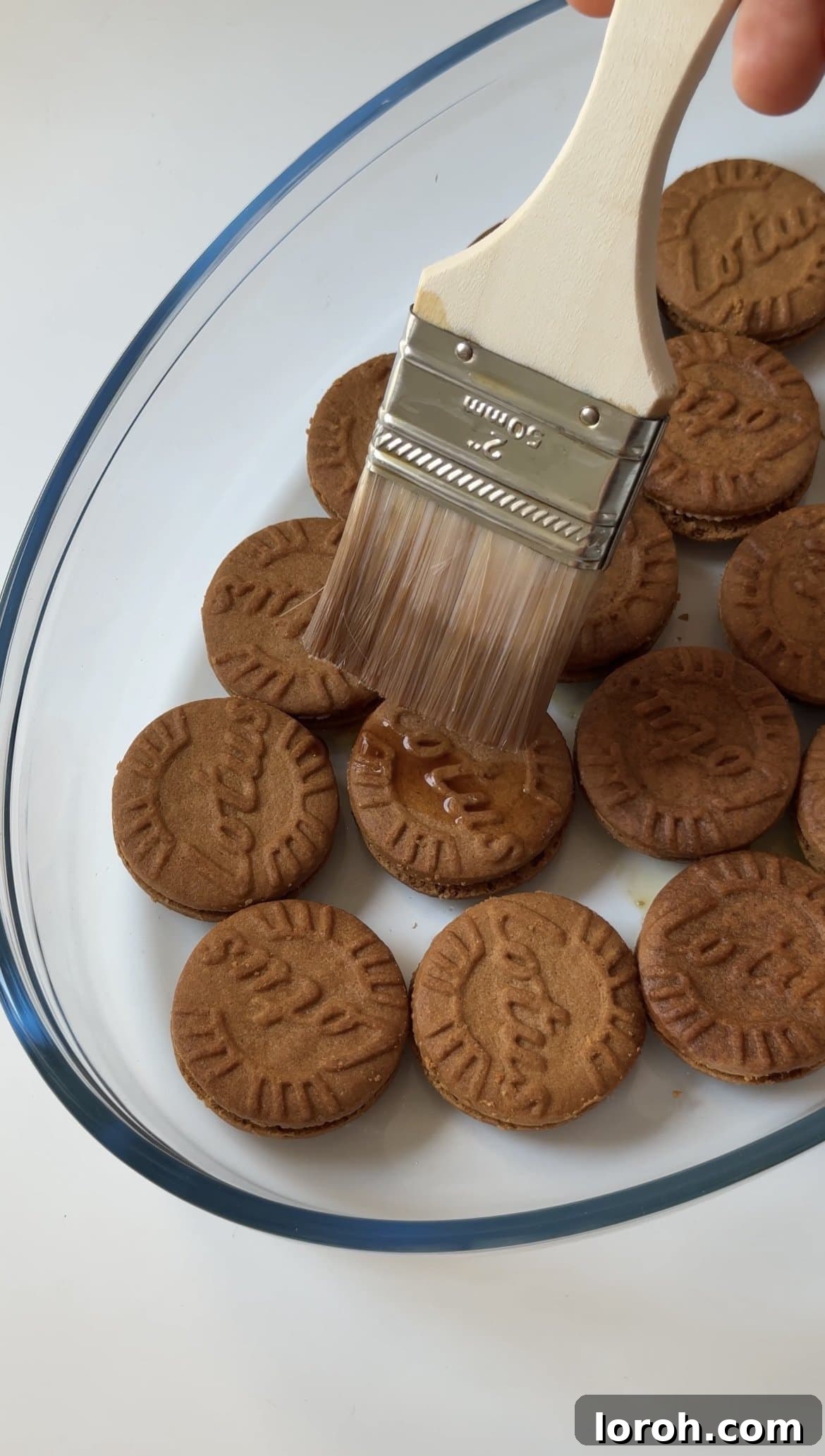 Spiced Speculoos Tiramisu 7 Laying Lotus biscuits and brushing with coffee