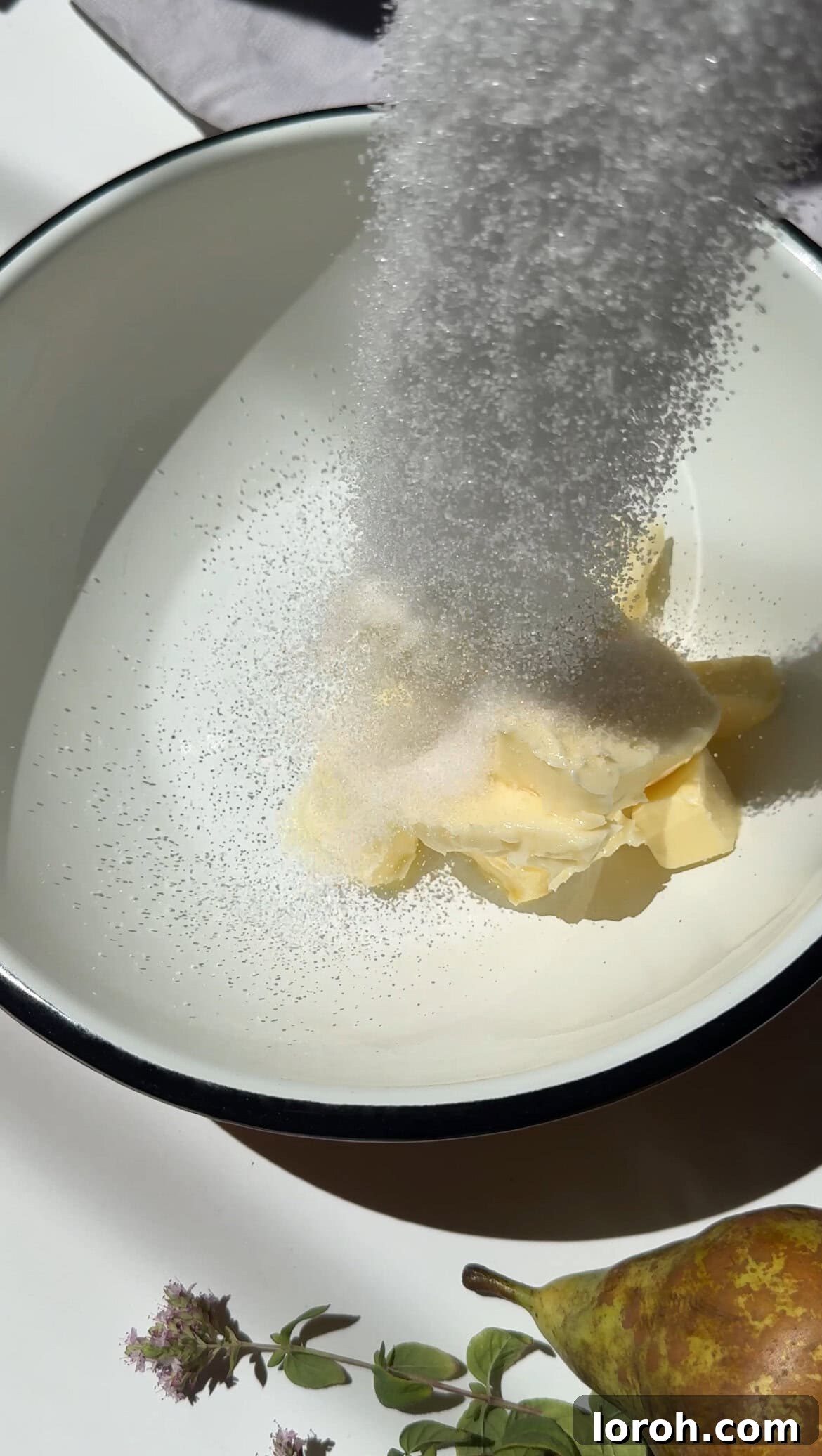 Decadent Chocolate Pear Dream 3 Softened butter and golden caster sugar being creamed together in a stand mixer.