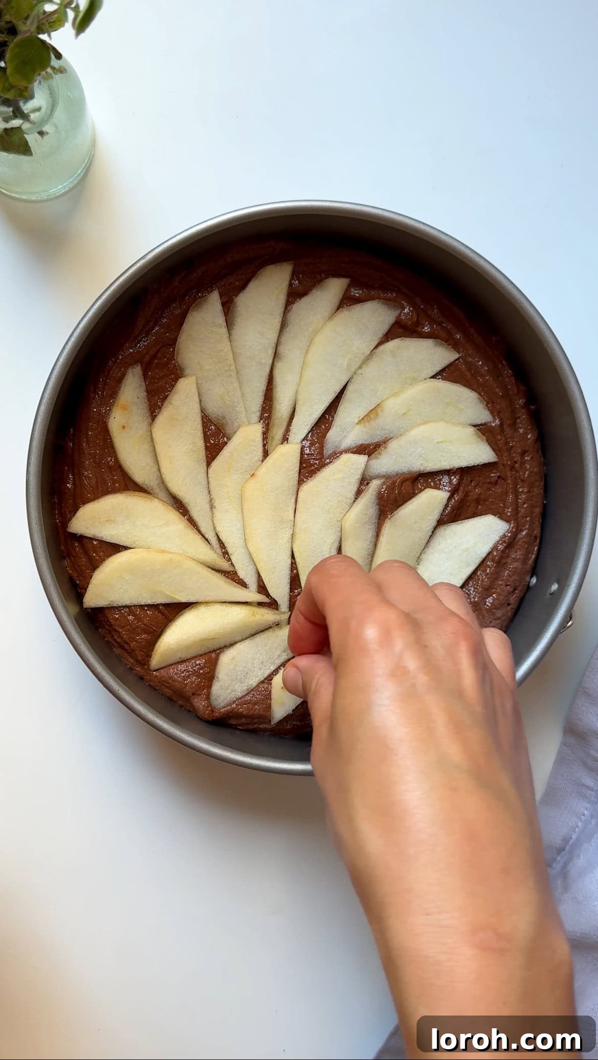 Decadent Chocolate Pear Dream 7 Remaining cake batter poured over the pears, smoothed, and decorated with fanned pear slices and demerara sugar.