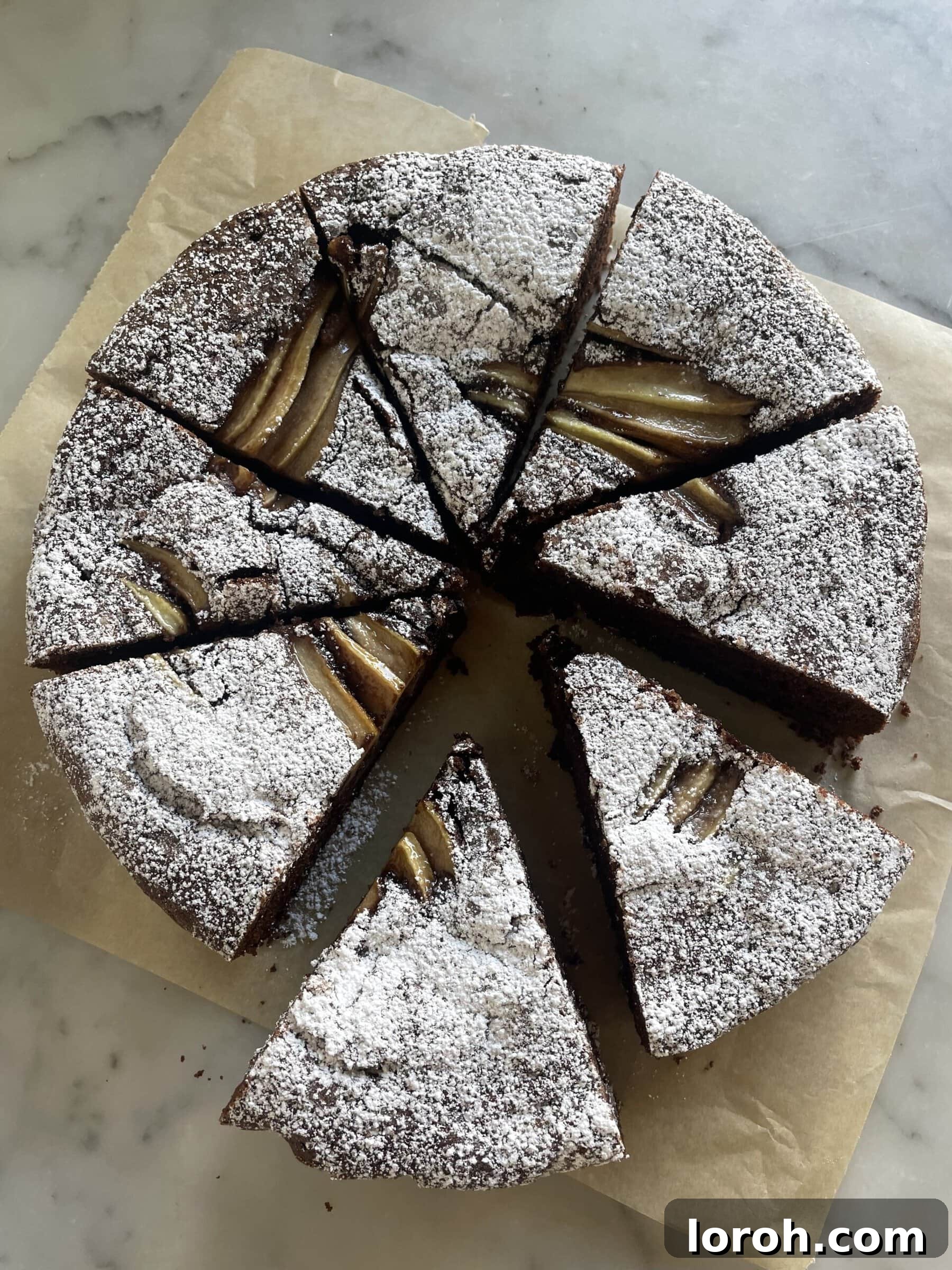 Decadent Chocolate Pear Dream 9 A beautifully sliced chocolate and pear cake, revealing the layers of chocolate sponge and tender pear.