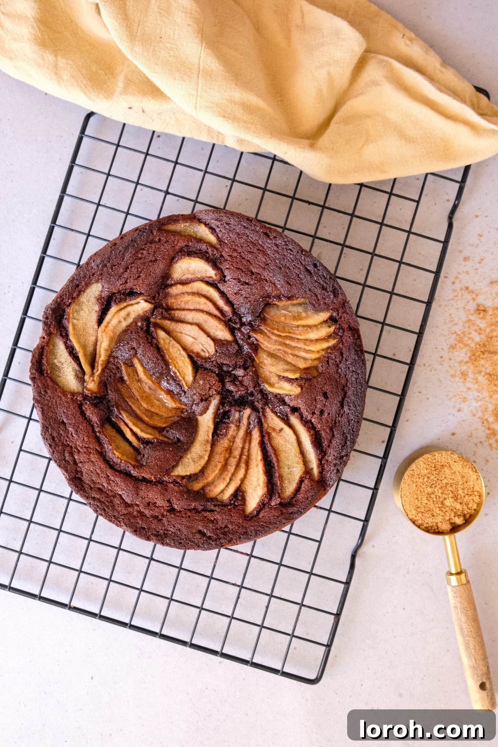 Decadent Chocolate Pear Dream 10 A whole chocolate and pear cake, beautifully baked and ready to be served.
