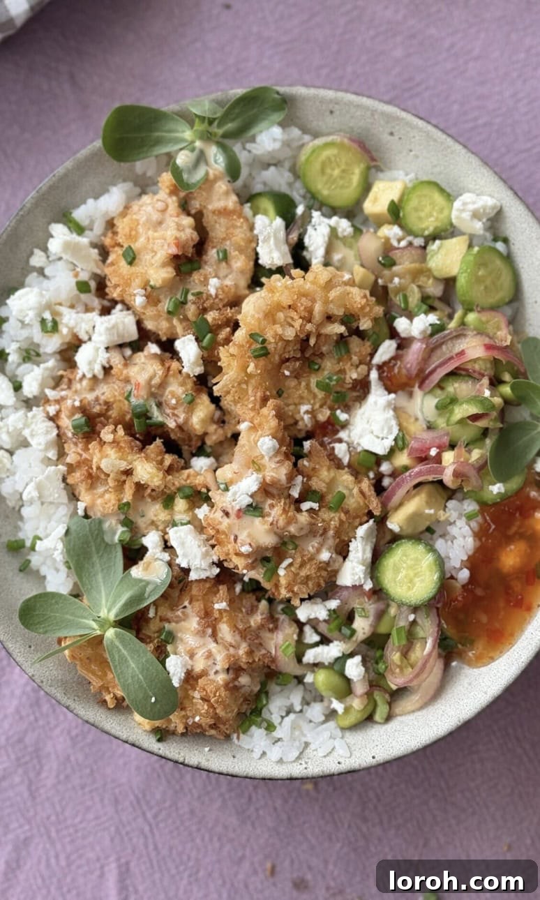 Golden Panko Shrimp Rice Bowl 11 panko prawn rice bowl with cucumber and sweet chilli sauce.