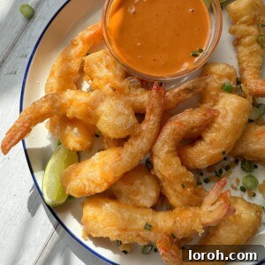 Close-up of freshly made Ebi Tempura, perfectly golden and crispy.