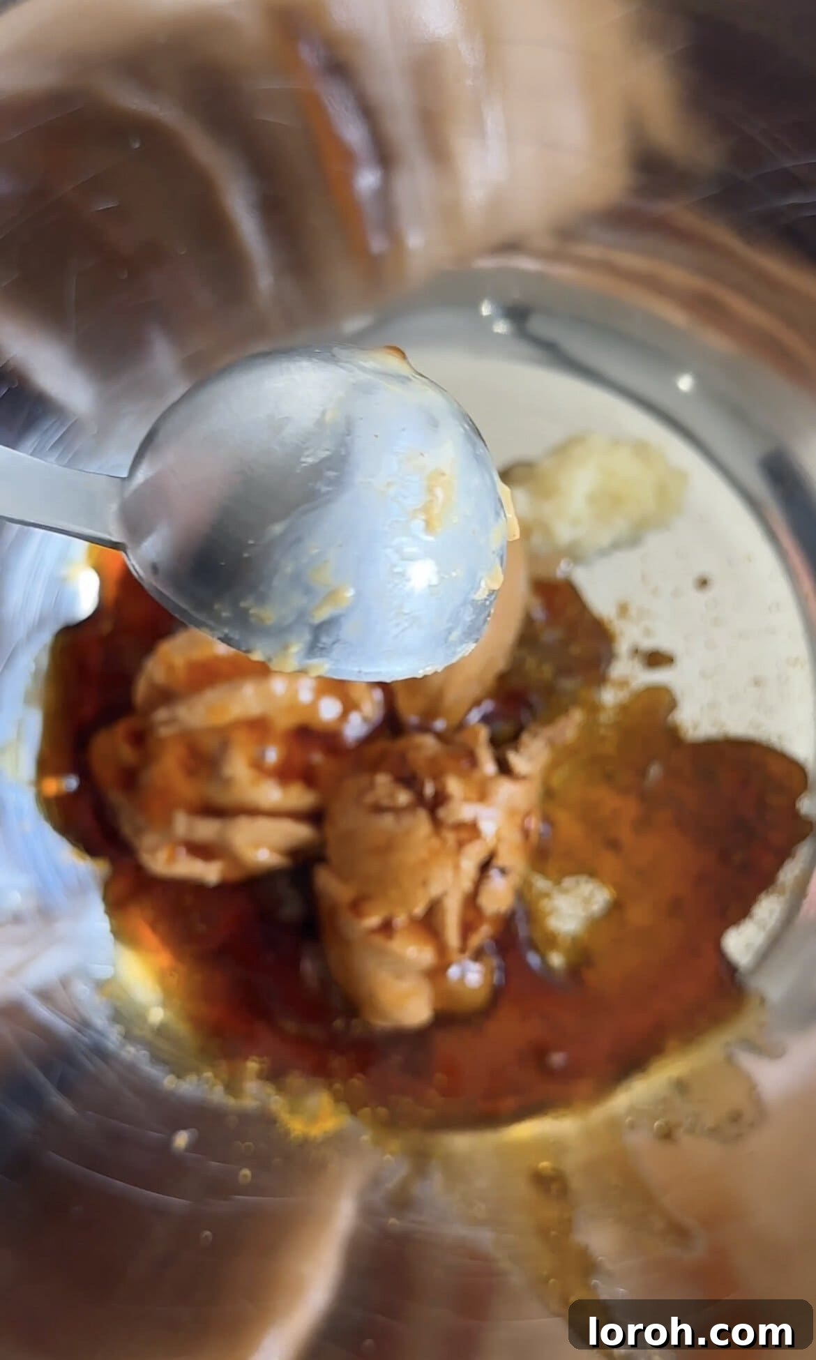 Mixing ingredients for chicken satay sauce in a bowl