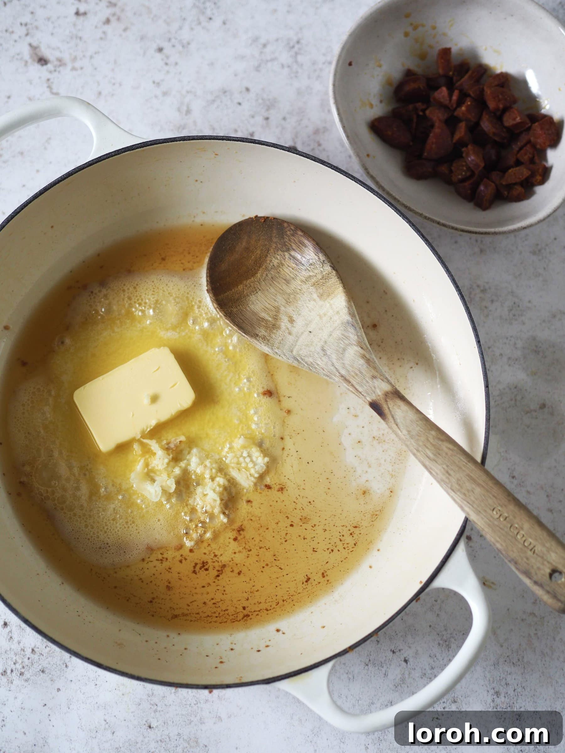 Decadent Gouda Mac and Cheese 5 Chorizo sizzling in a pan until crisp, releasing its smoky oils.