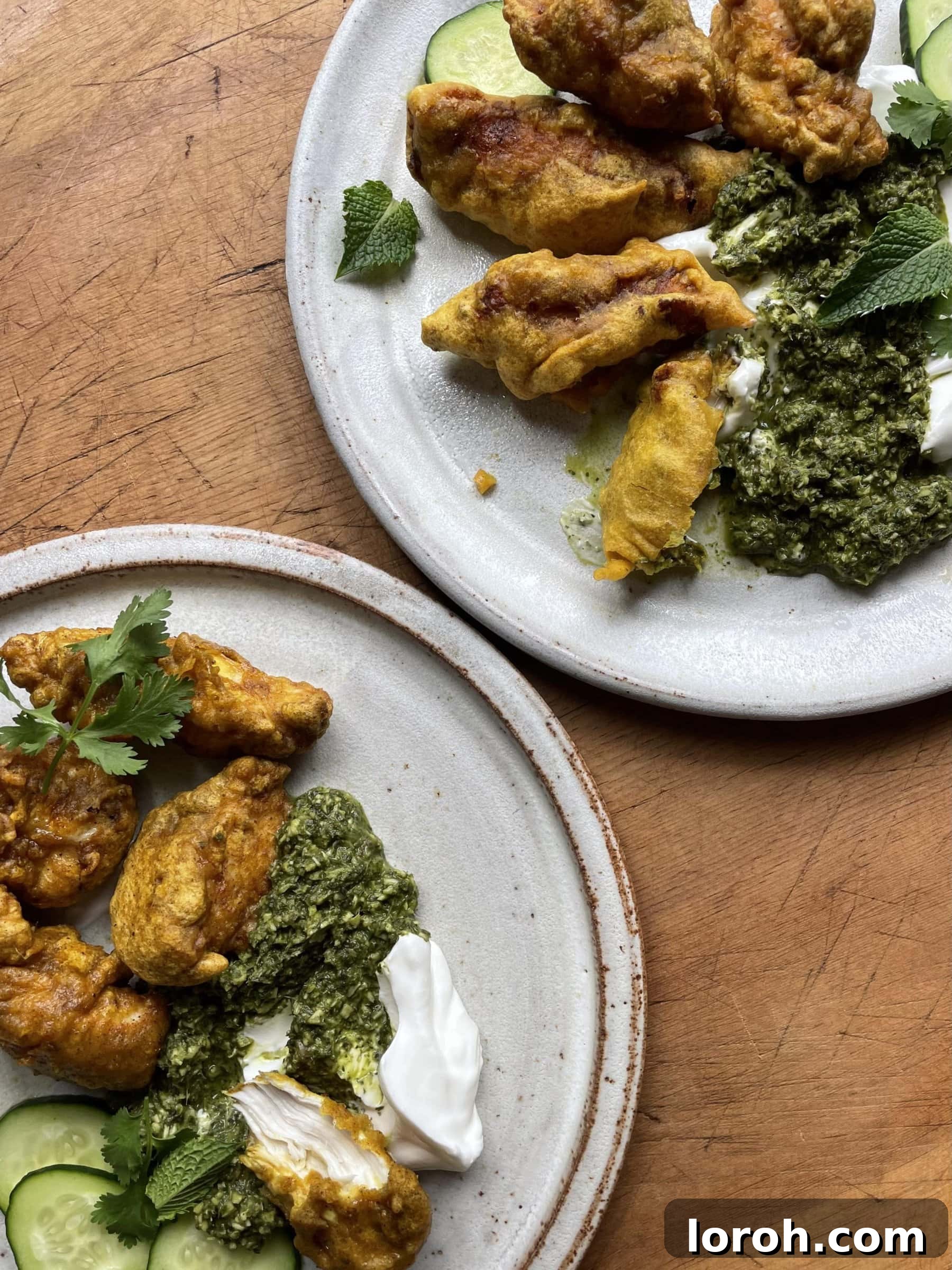 Pile of golden brown fried Chicken Pakora on a serving dish.