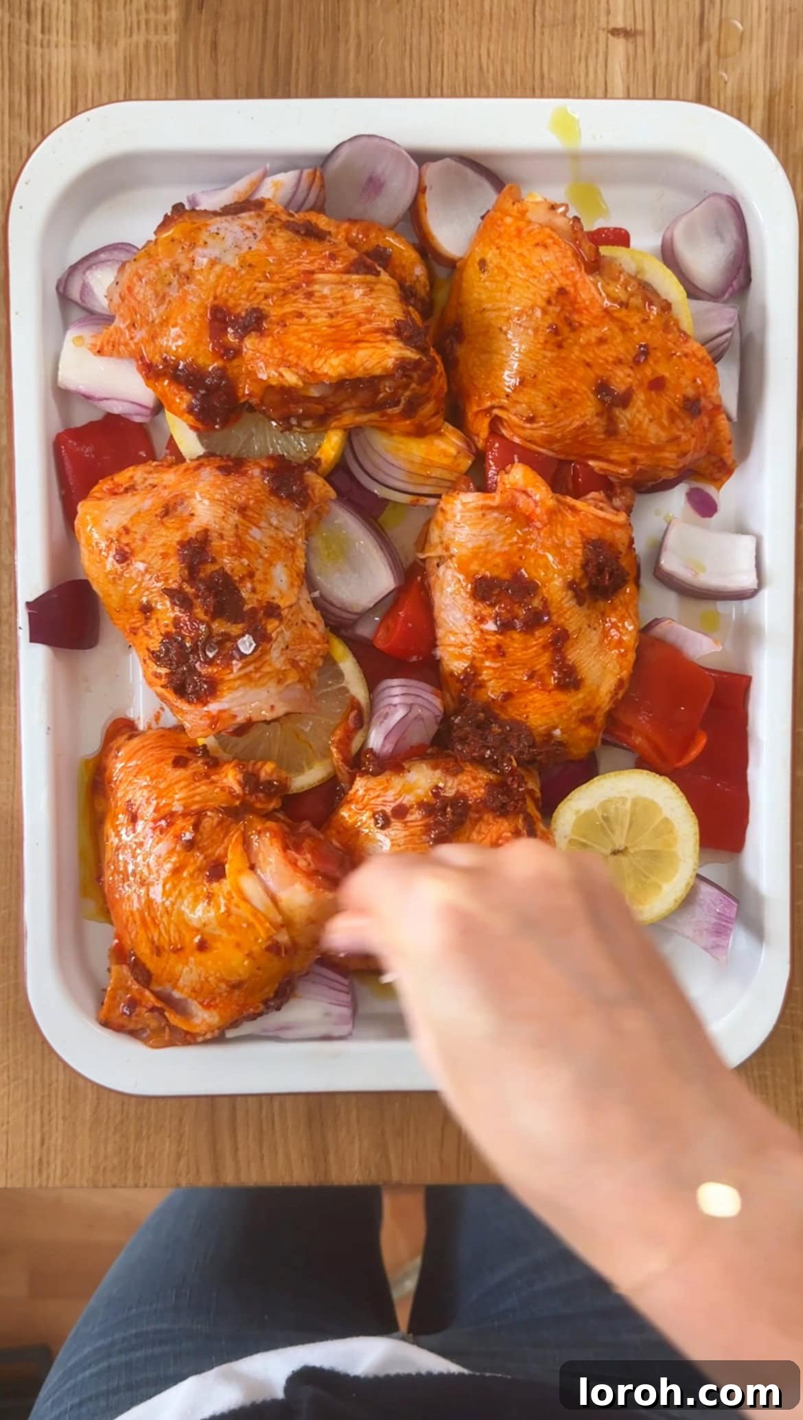 Step three: placing chicken on top of vegetables and seasoning