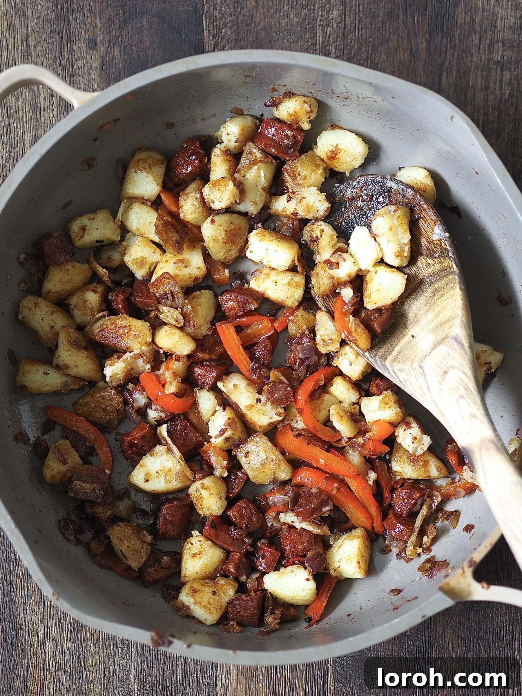 Spicy Chorizo and Golden Potato Morning Skillet 8 Combining the crispy potatoes with the cooked onions, peppers, and chorizo back in the pan.