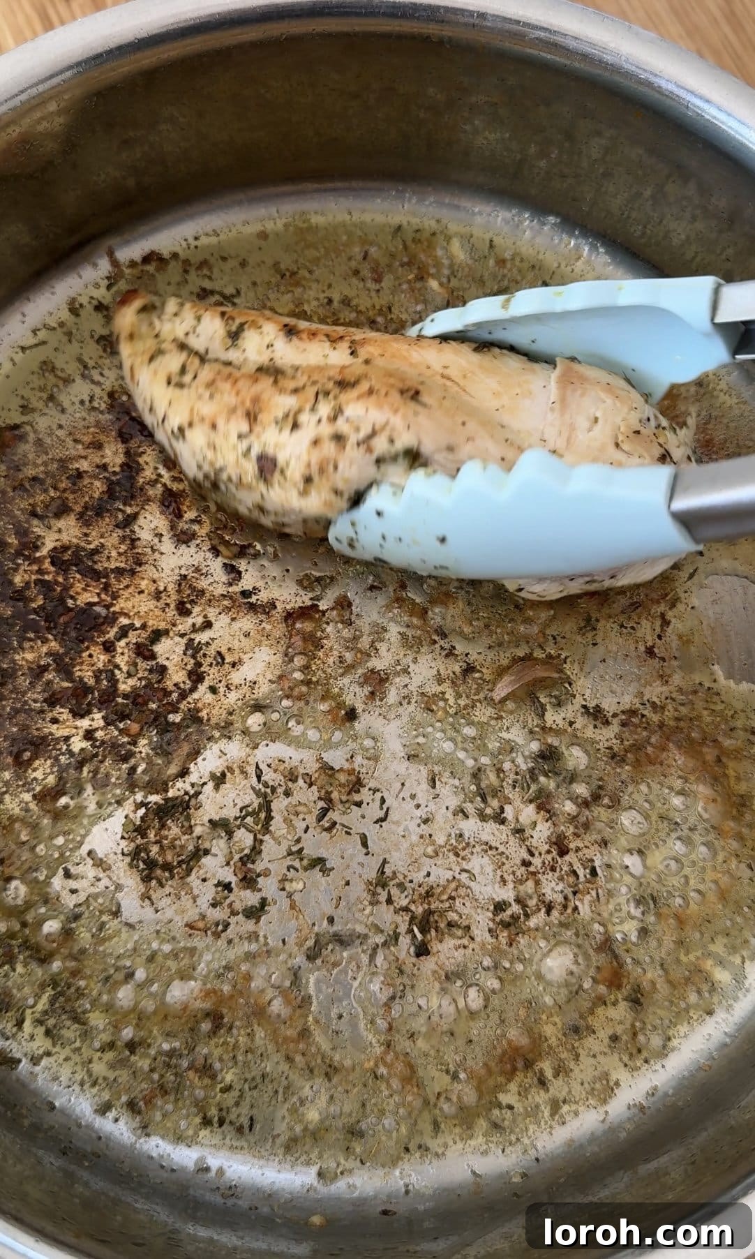 Velvety Chicken Pasta 5 Chicken breasts sizzling in a hot non-stick frying pan, achieving a golden-brown crust.