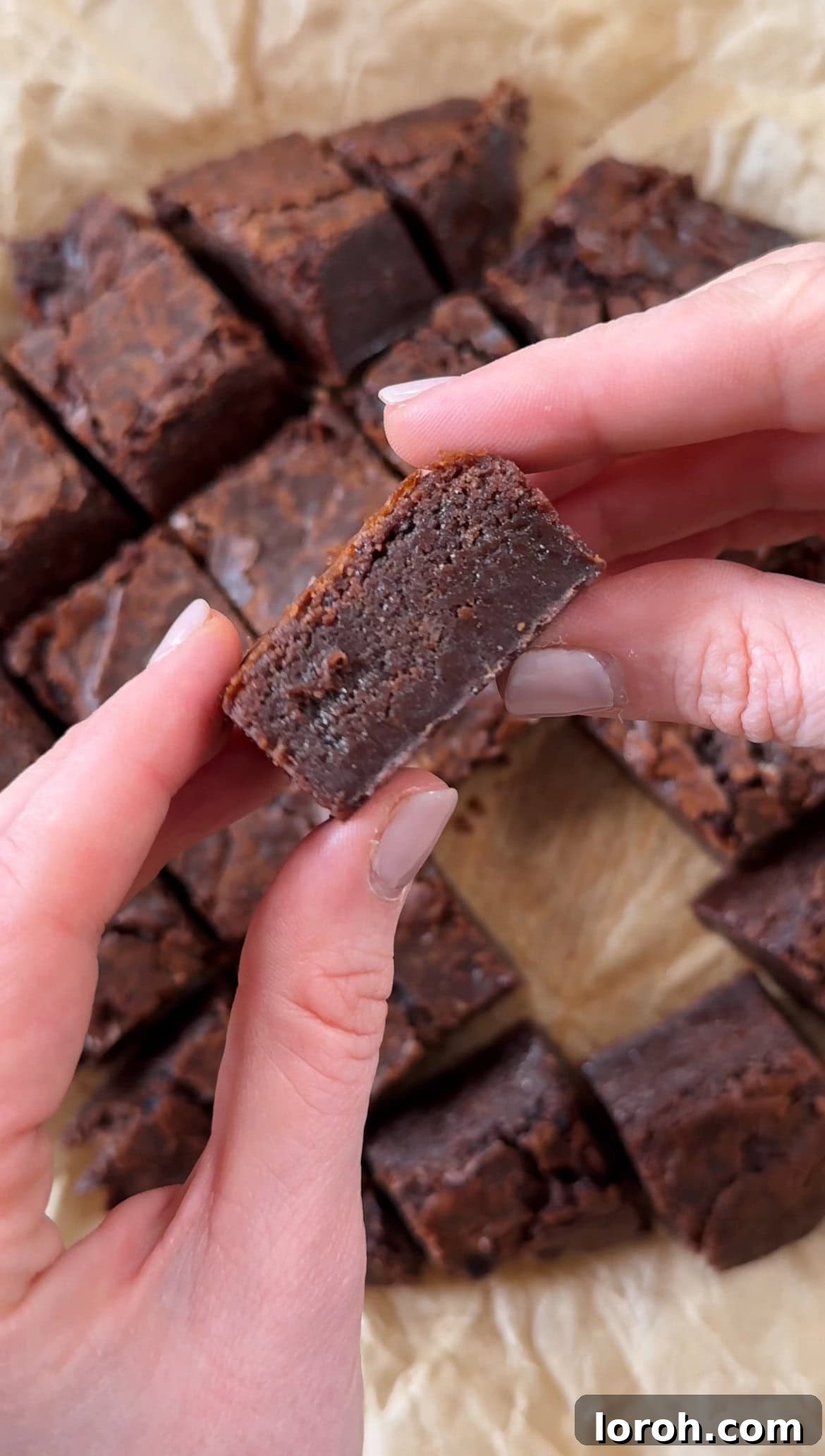 Freshly baked brownies, cooled and ready to be sliced into bite-sized pieces for the trifle dessert.