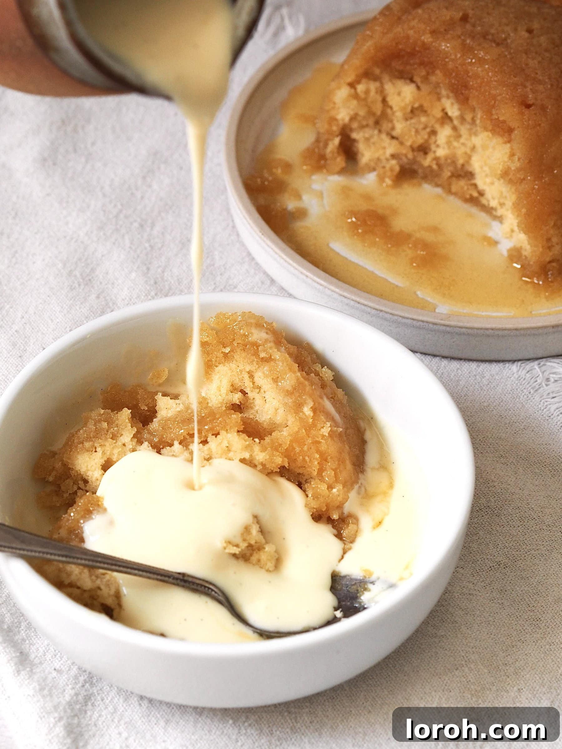 Pouring custard over Microwave Syrup Sponge