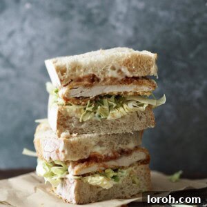Chicken Katsu Sandwich stacked high with crispy chicken and fresh cabbage.