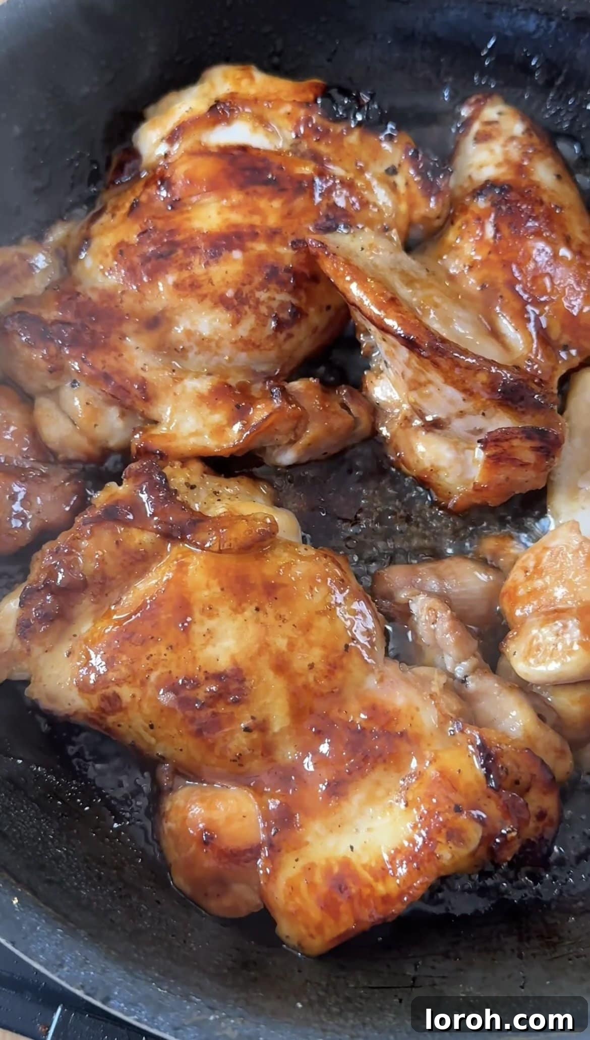 Step two: Pan-frying the marinated chicken thighs.