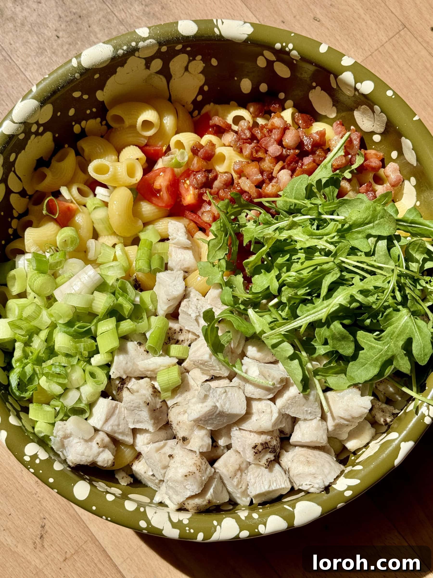 Creamy Chicken Macaroni Delight 11 chicken macaroni pasta salad served in a bowl with a fork