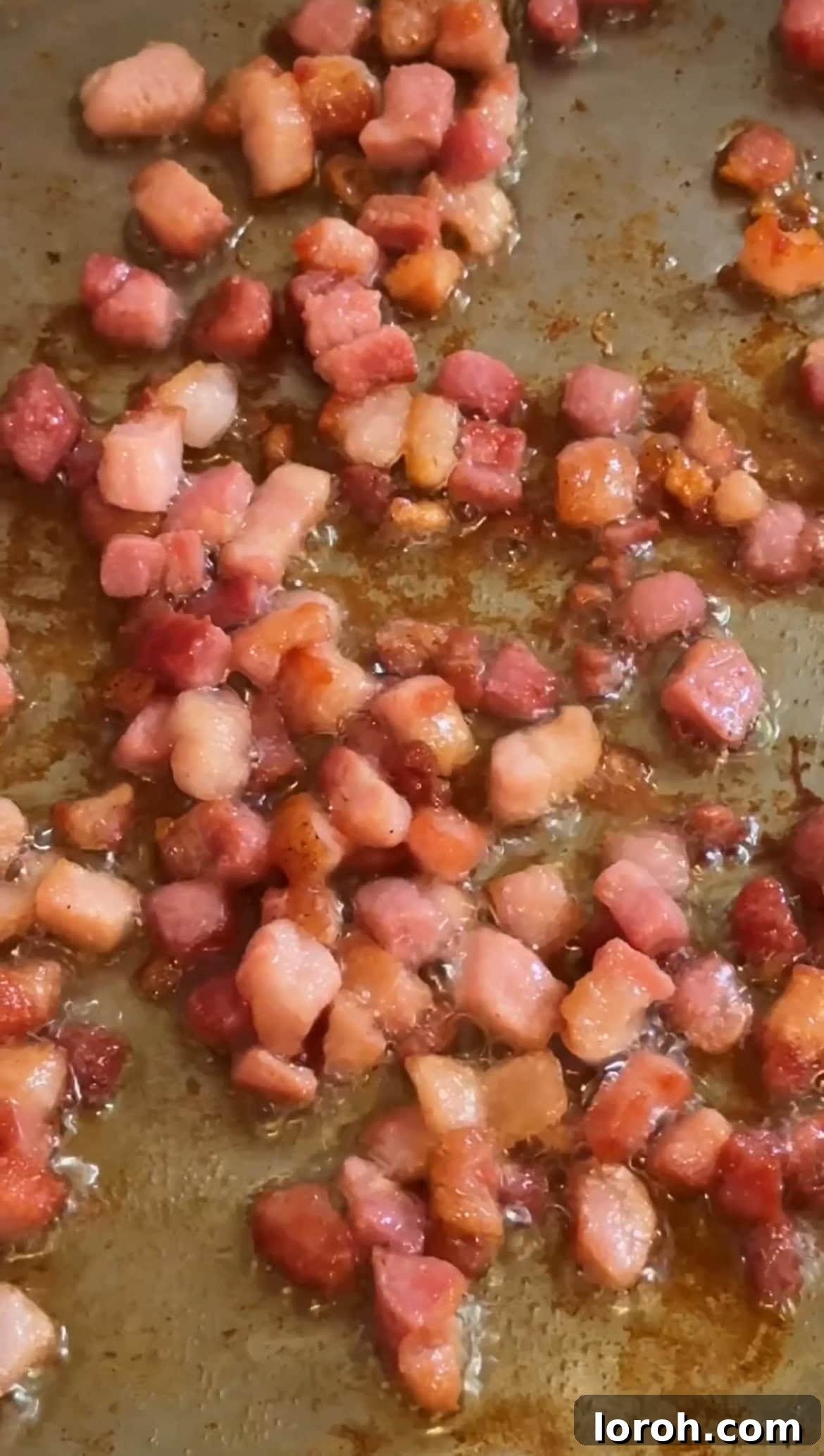 Creamy Chicken Macaroni Delight 6 frying pancetta cubes in a hot pan until crispy