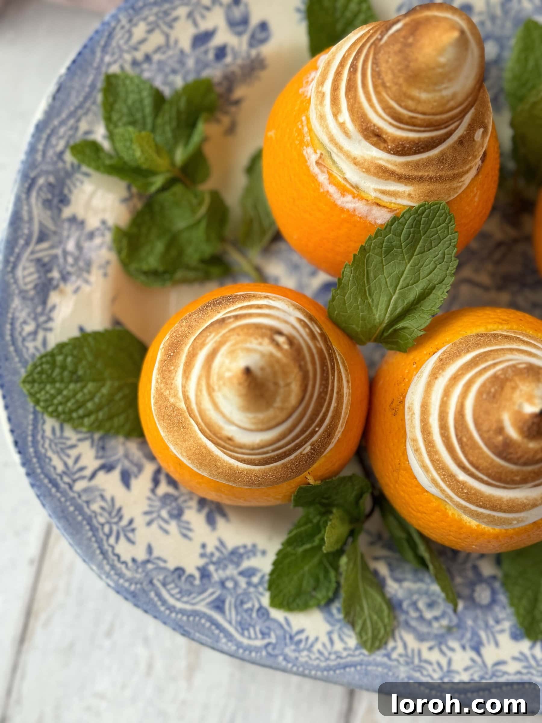 Citrus Cocoa Cloud 3 Close-up of fluffy chocolate orange mousse with a delicate brown sugar meringue, showcasing its airy texture and elegant topping.
