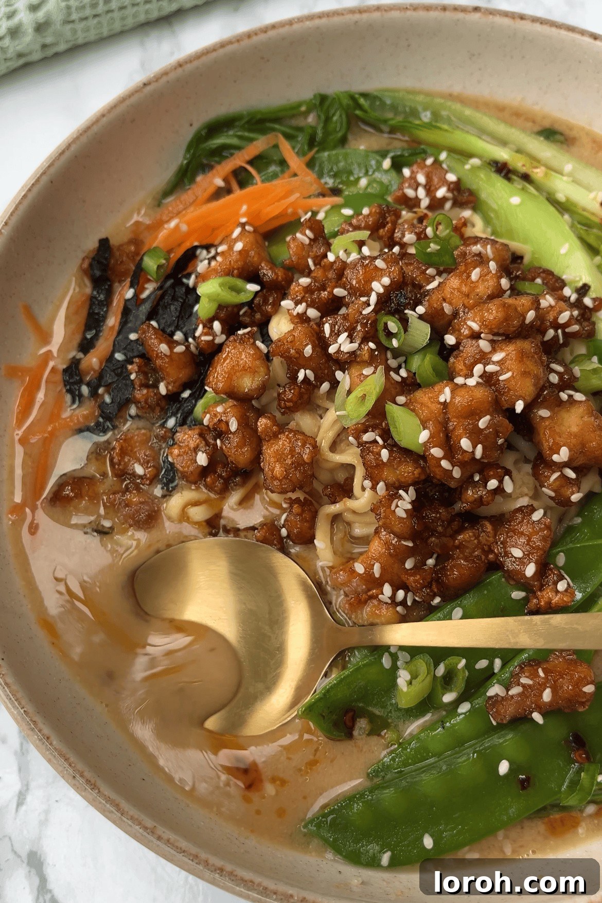 Close-up of Tofu Noodle Soup ingredients arranged beautifully, highlighting fresh ginger and garlic.