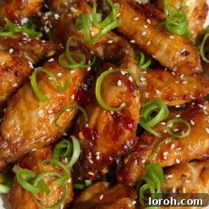 Hot Honey Chicken Wings, glossy with sauce.