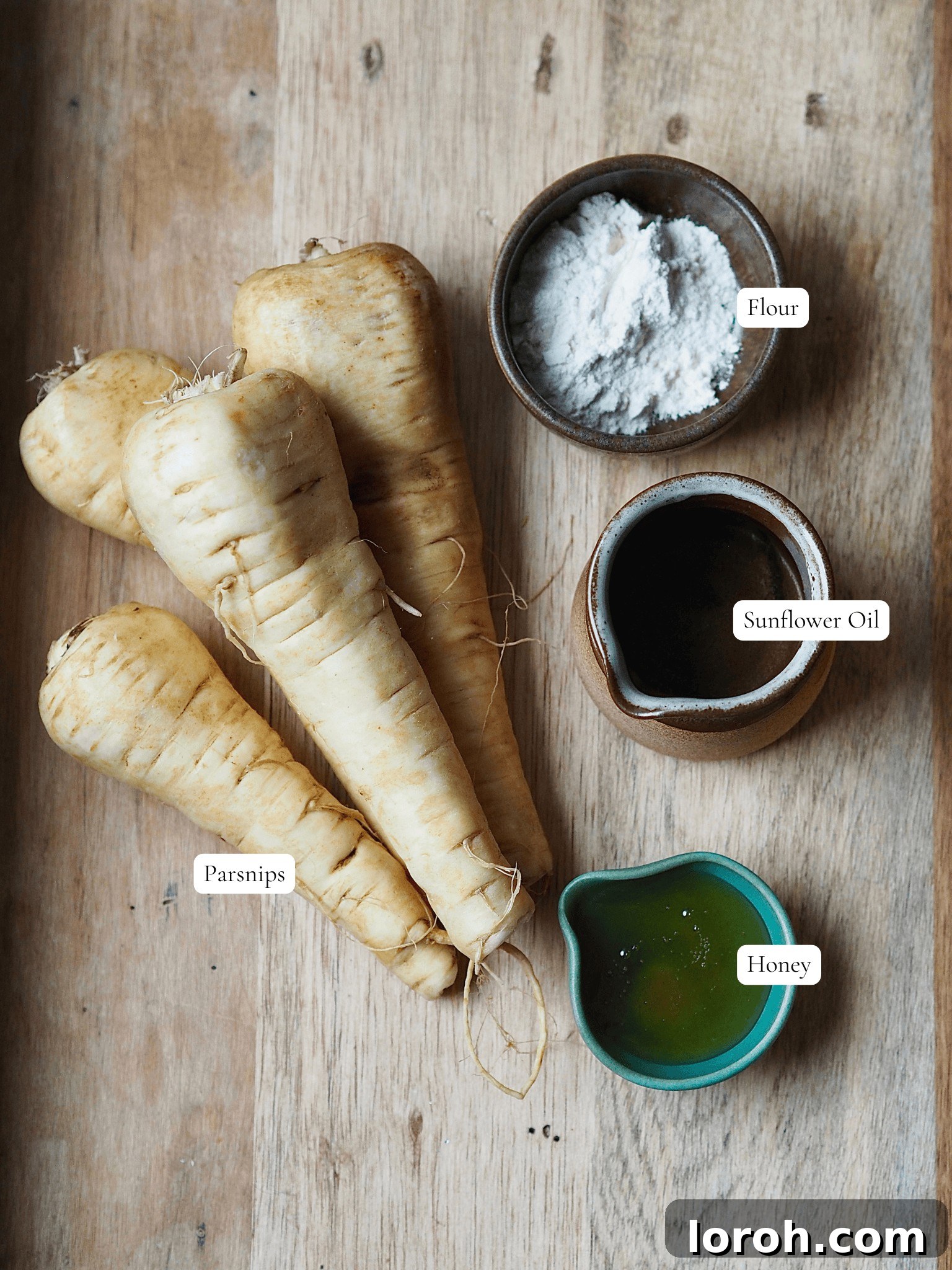 Ingredients laid out and labeled to make air fryer honey glazed parsnips.