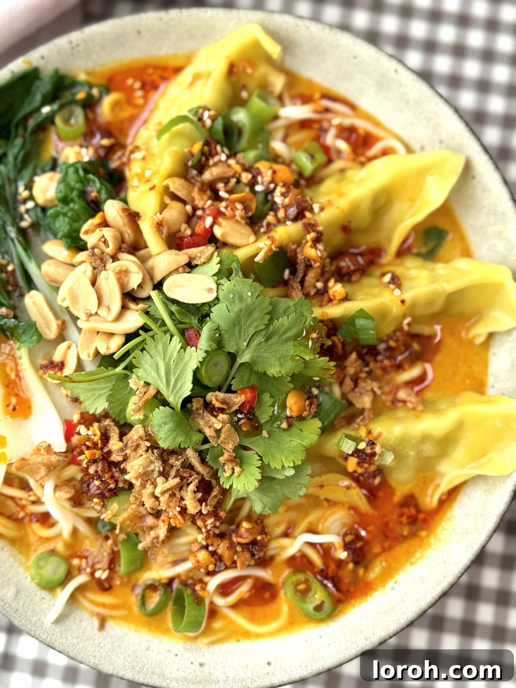Aromatic Wonton Noodle Delight 12 A beautifully presented bowl of Wonton Noodle Soup, garnished