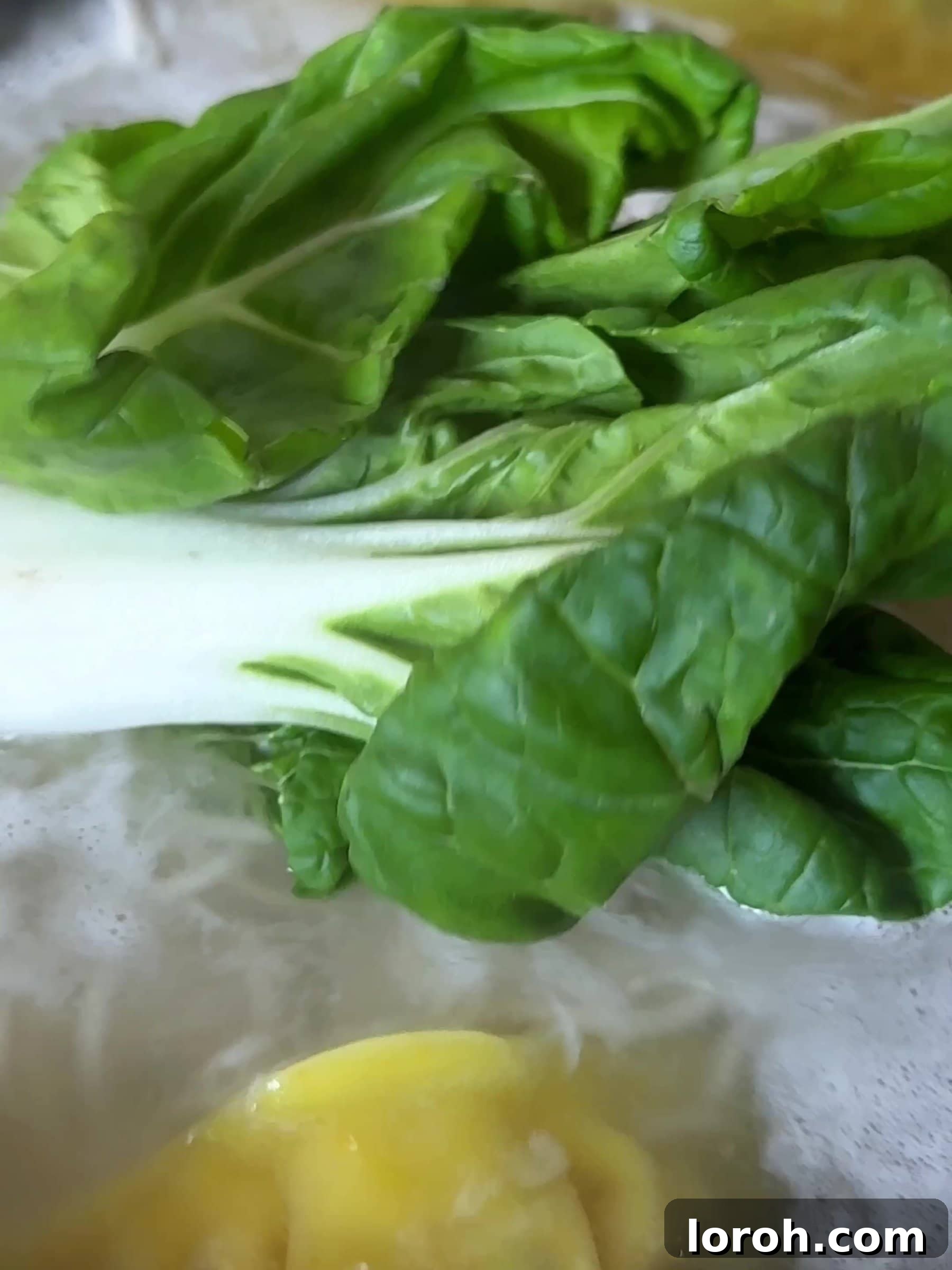 Aromatic Wonton Noodle Delight 9 Adding pak choi to cooked noodles and wontons