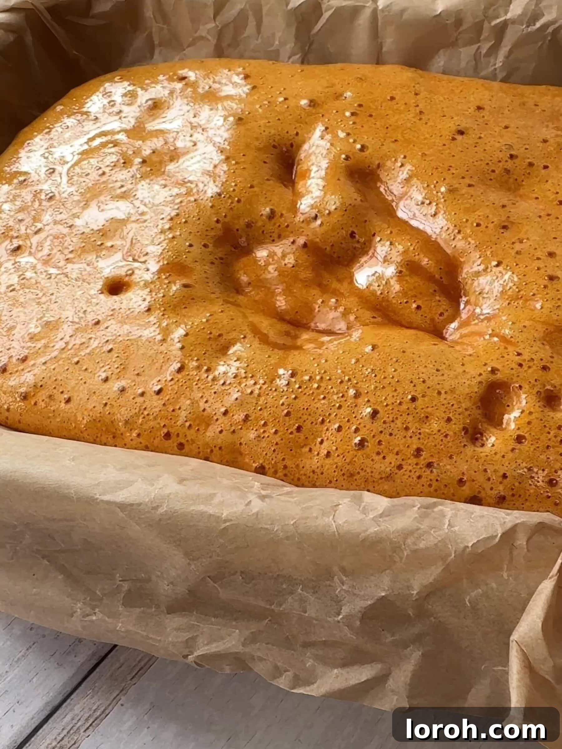 Golden Honeycomb Crunch Ice Cream 6 Pouring hot honeycomb mixture into a prepared baking tin