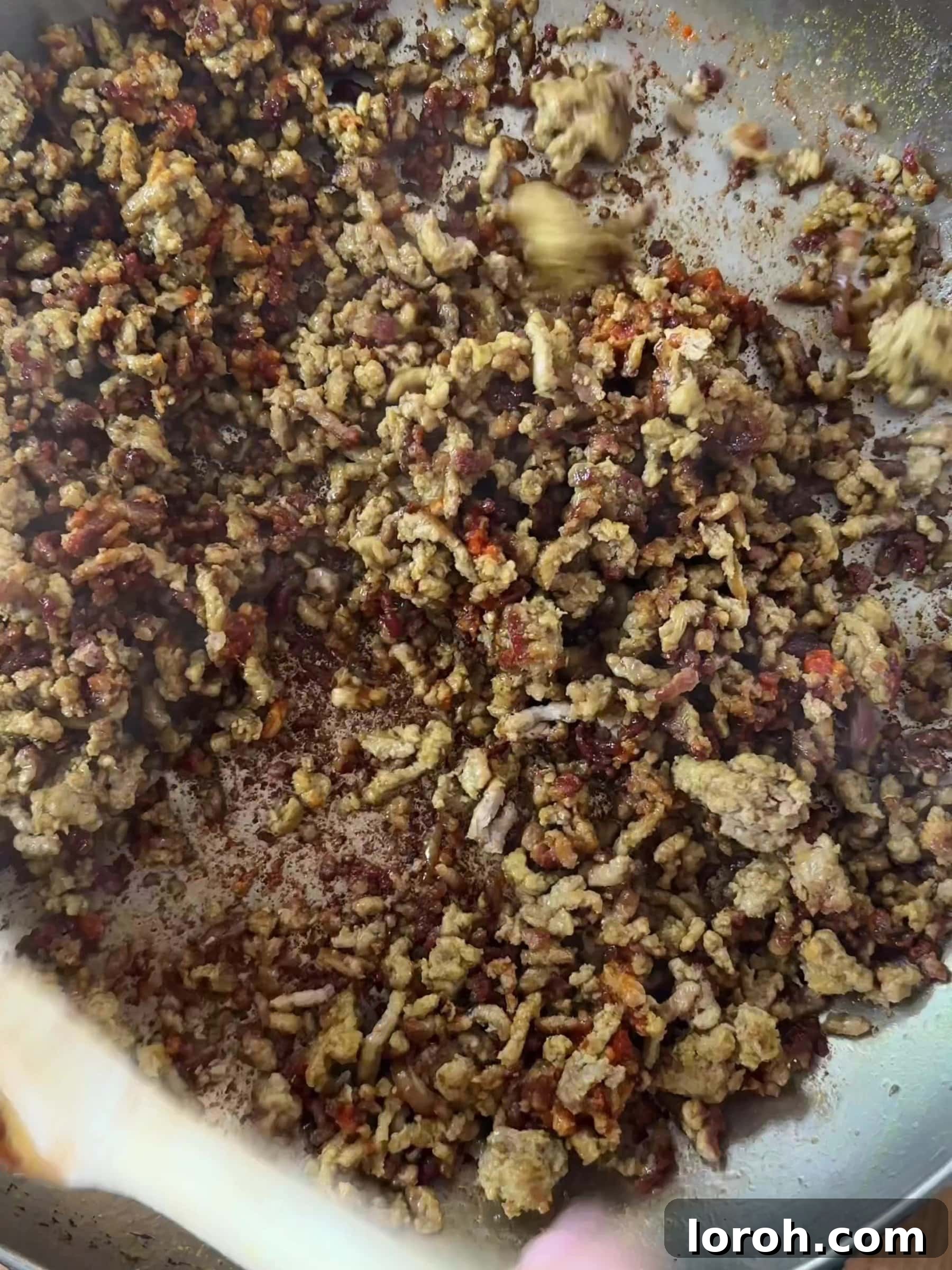 Golden Lamb & Couscous with Bright Herb Salad 5 Close-up of lamb mince achieving a deliciously crispy and golden brown texture in the pan.