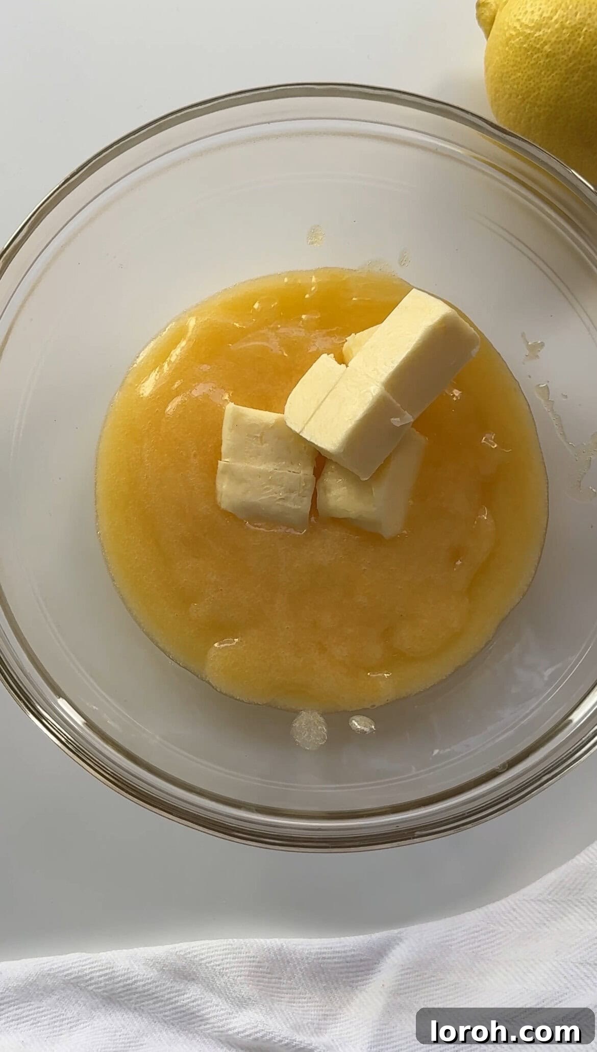 Zesty Lemon Meringue Delight 12 stirring cold butter cubes into warm lemon curd until melted