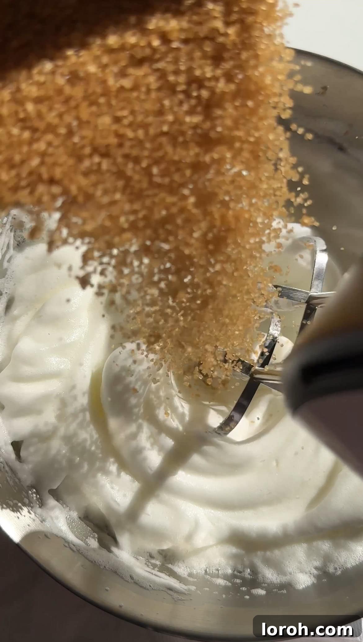 Zesty Lemon Meringue Delight 14 whisking egg whites to soft peaks while sugar syrup heats for Italian meringue