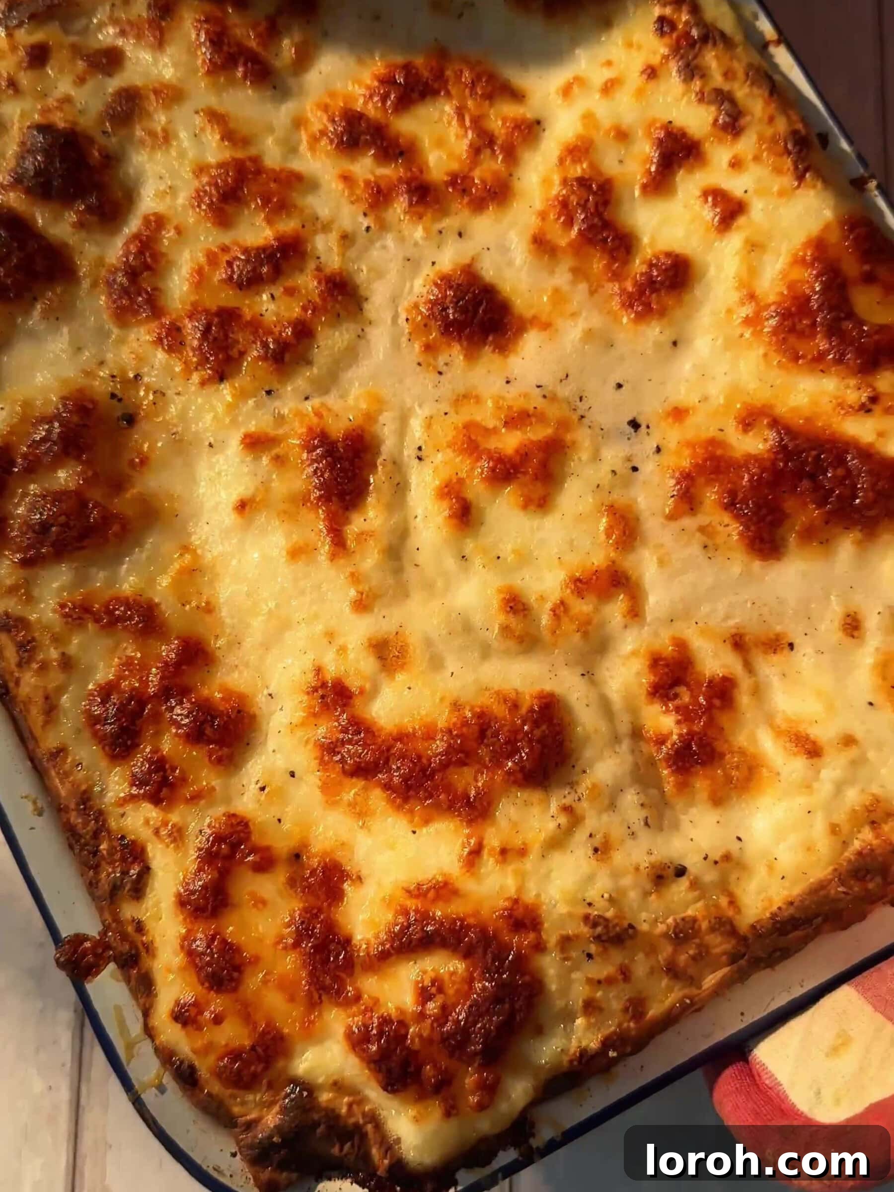 Basil Bliss Lasagna Bake 13 The fully baked and golden-brown lasagne al pesto in its baking dish.