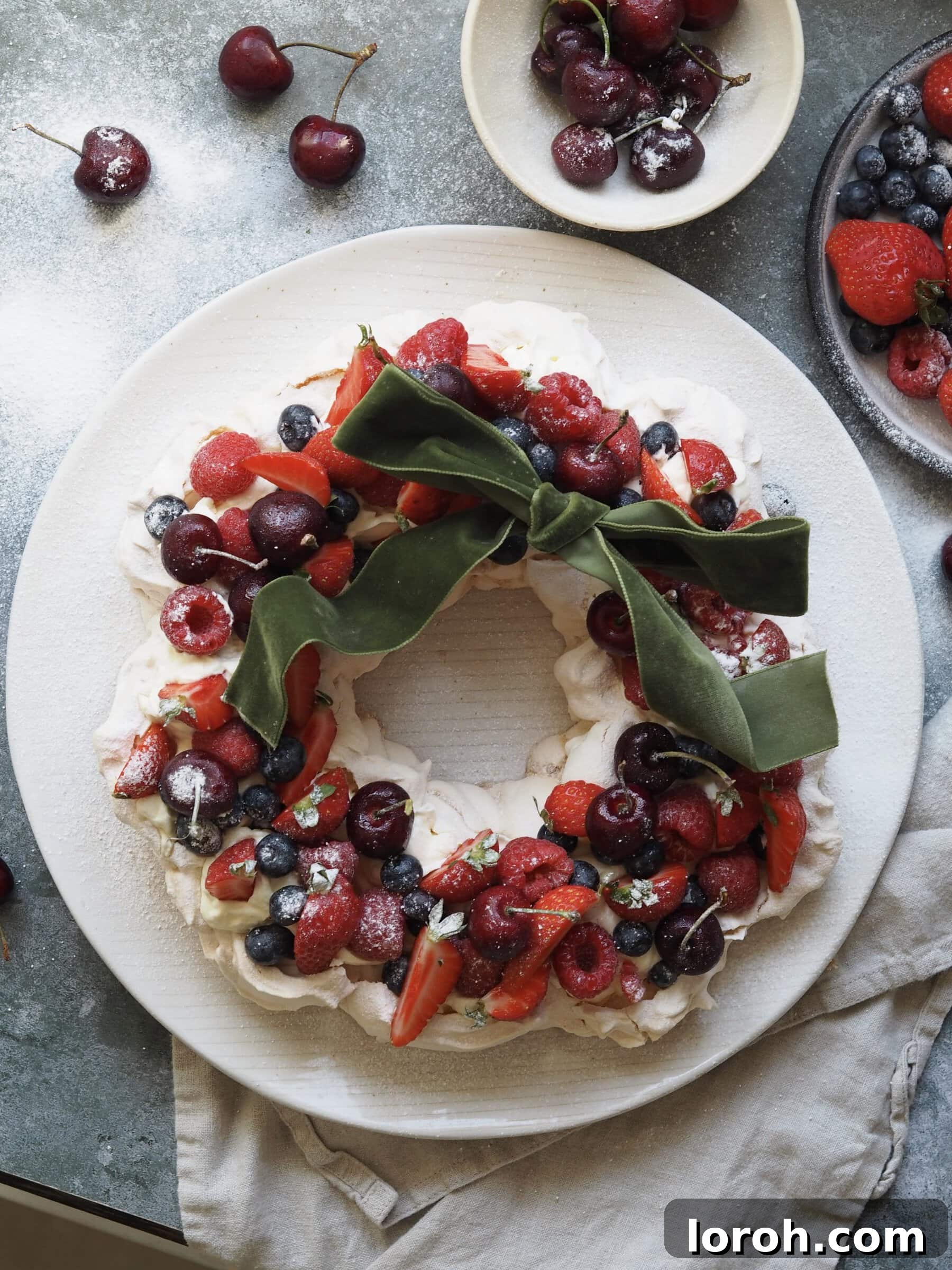 Festive Meringue Wreath 16 Christmas Pavlova on a plate with ribbon