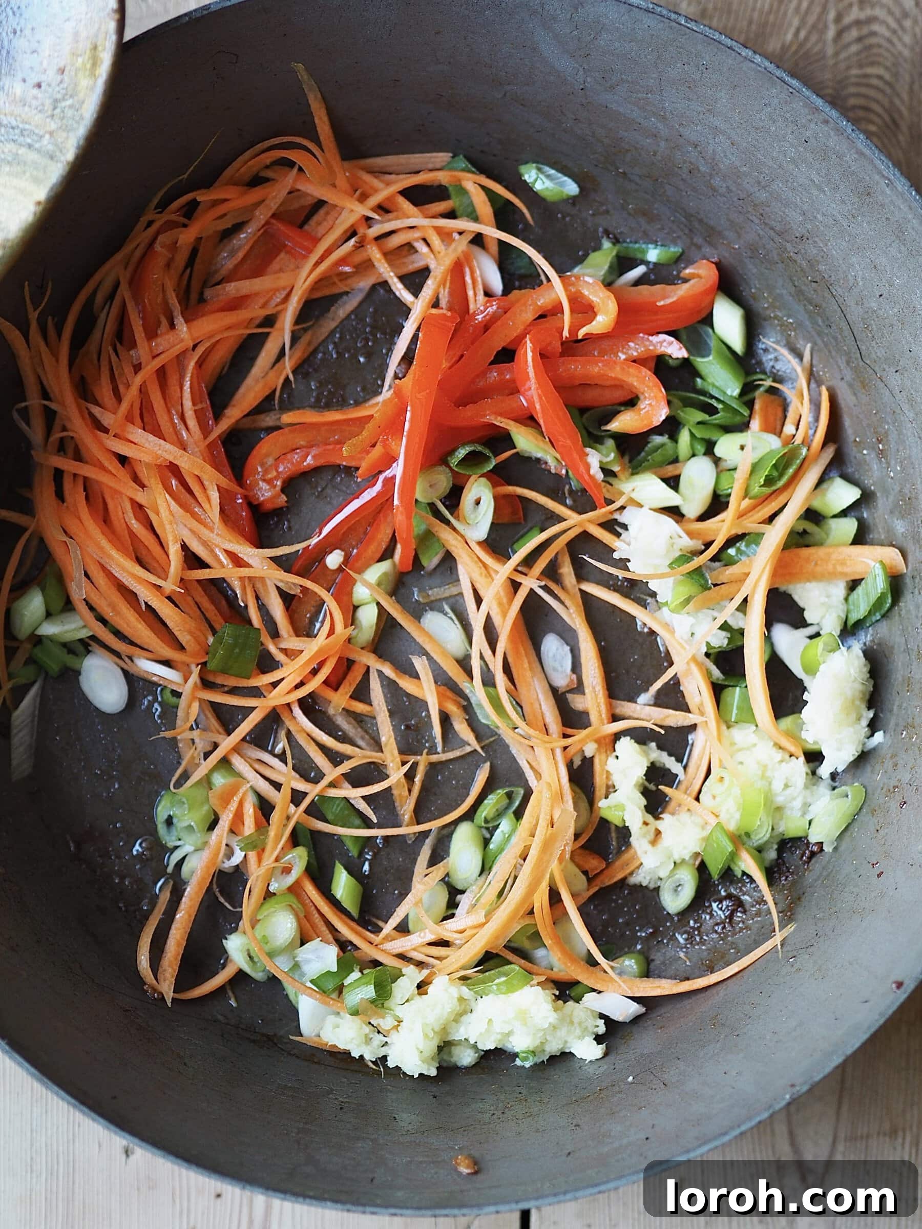 Double Delight Fried Rice 6 Adding vegetables to the pan