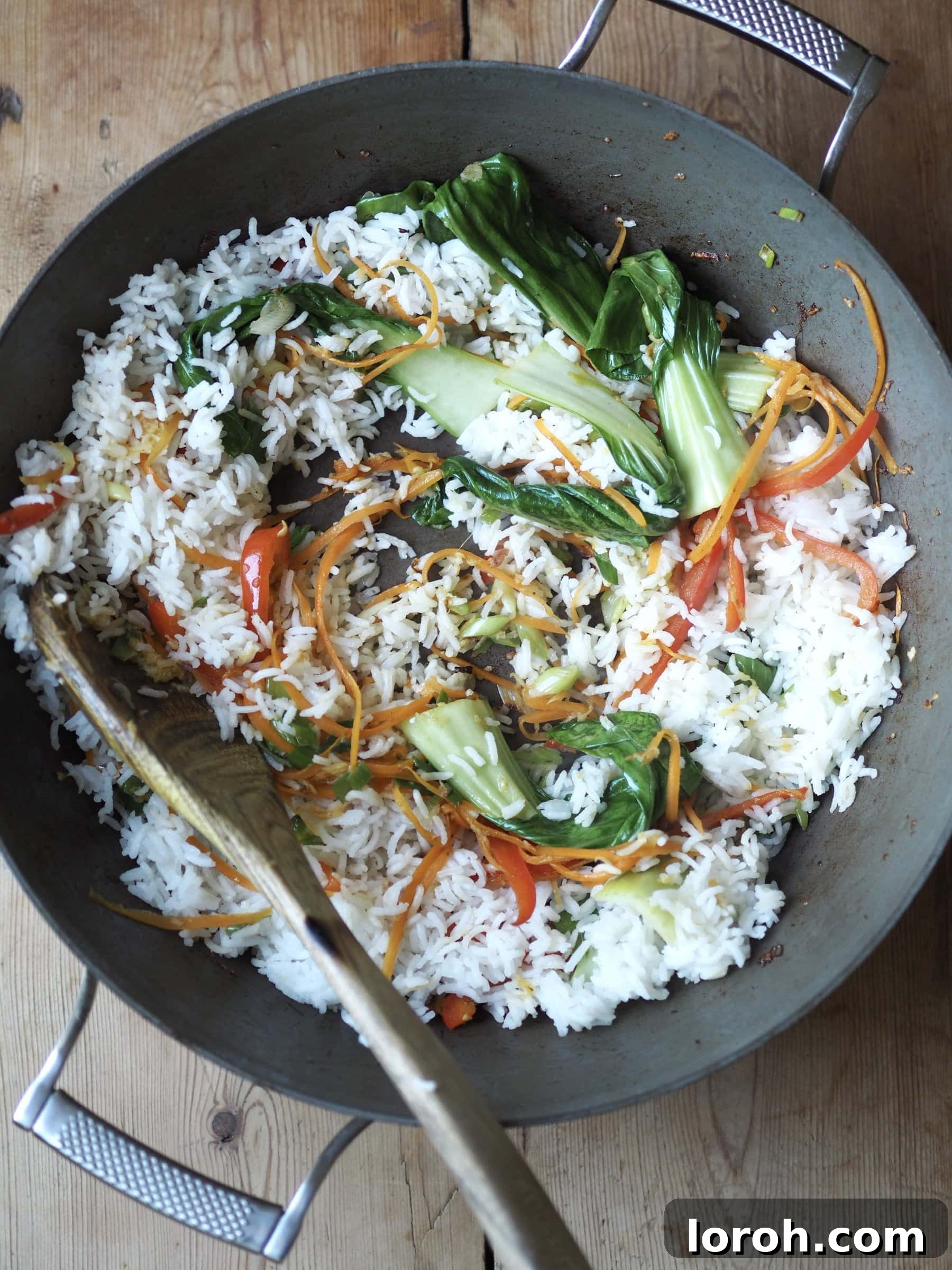 Double Delight Fried Rice 7 Adding the rice in a pan with vegetables, shrimp and chicken