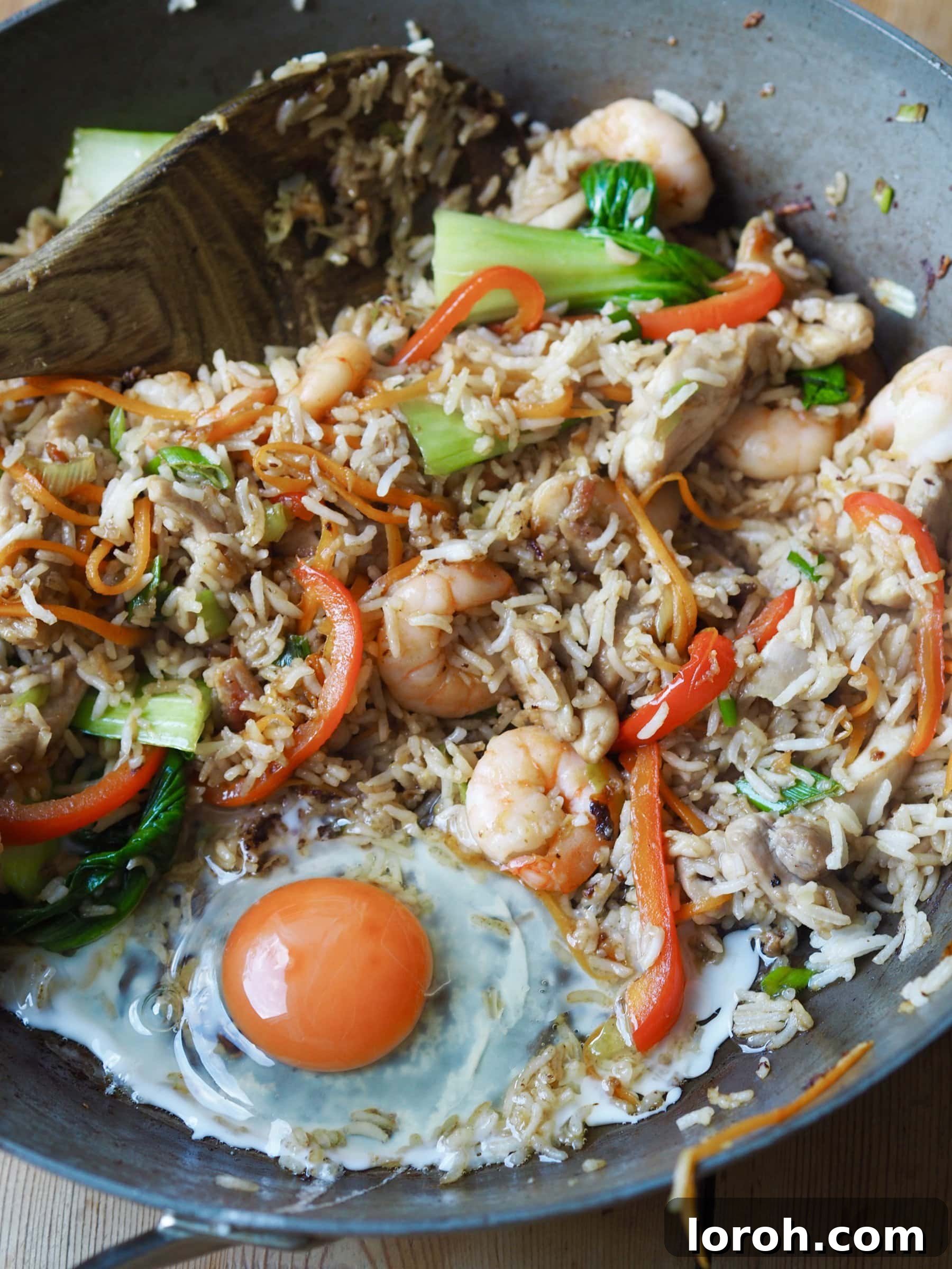 Double Delight Fried Rice 8 Adding a n egg to the rice mixture