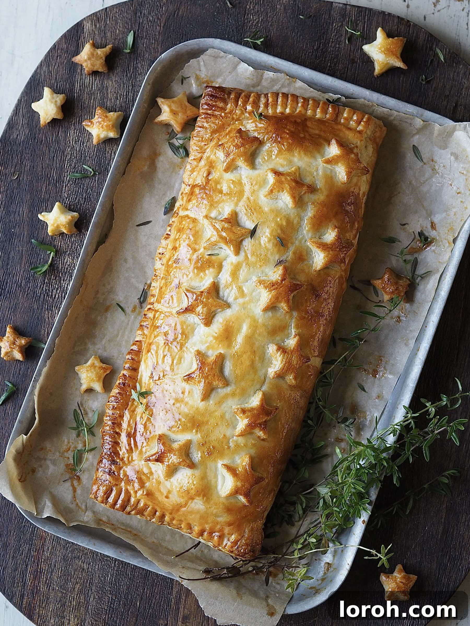Freshly baked golden and crisp Nut Roast Wellington on a baking tray