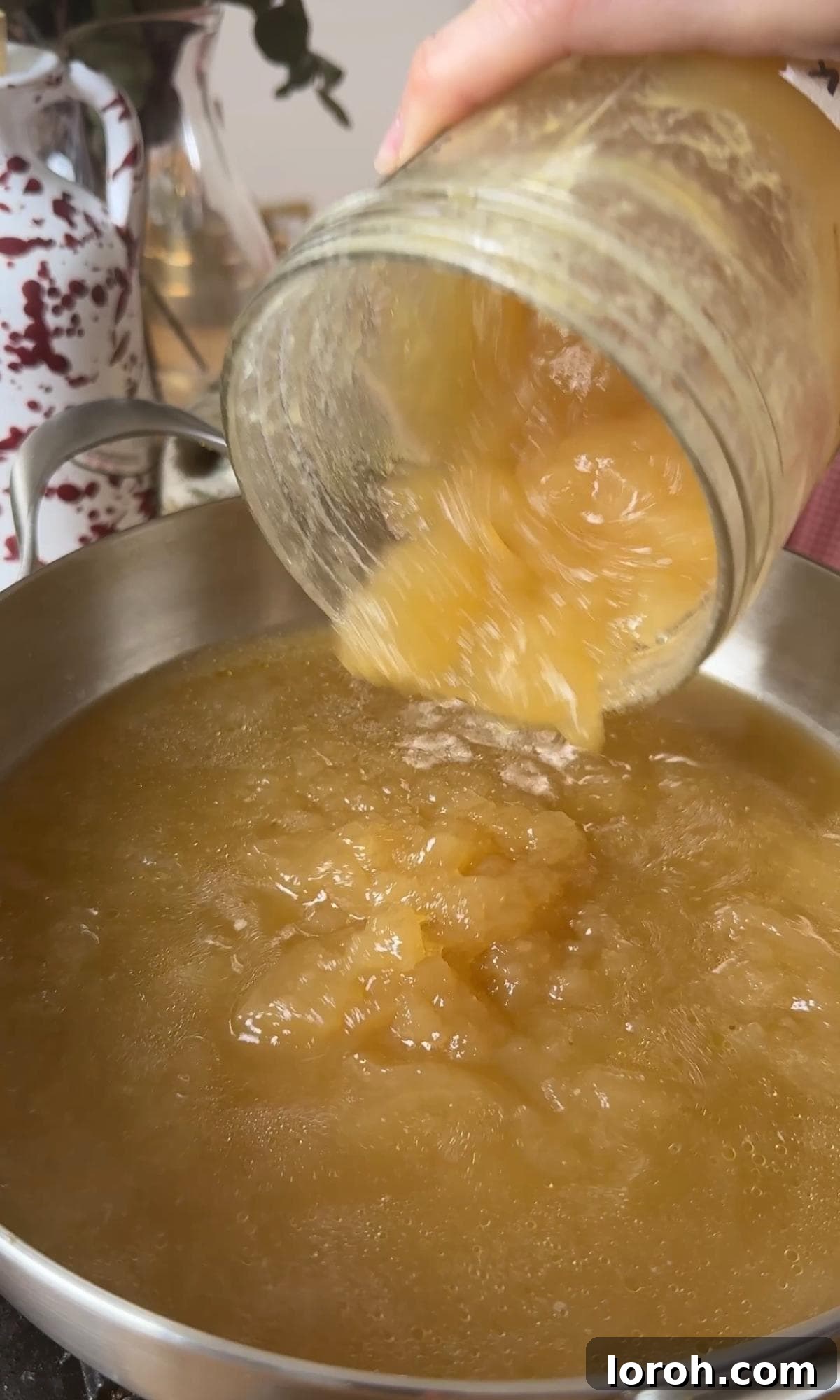 Velvety Easy Pastina 4 Adding chicken stock to a pan over medium-high heat.
