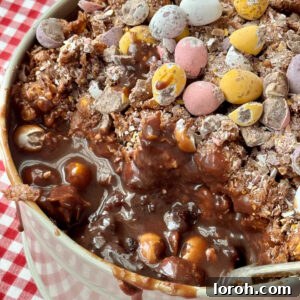 Finished Cornflake Dream Cake with Mini Eggs, showcasing its beautiful layers.