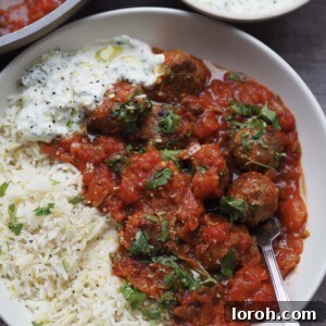 lamb mince meatballs with rice and tomato sauce.